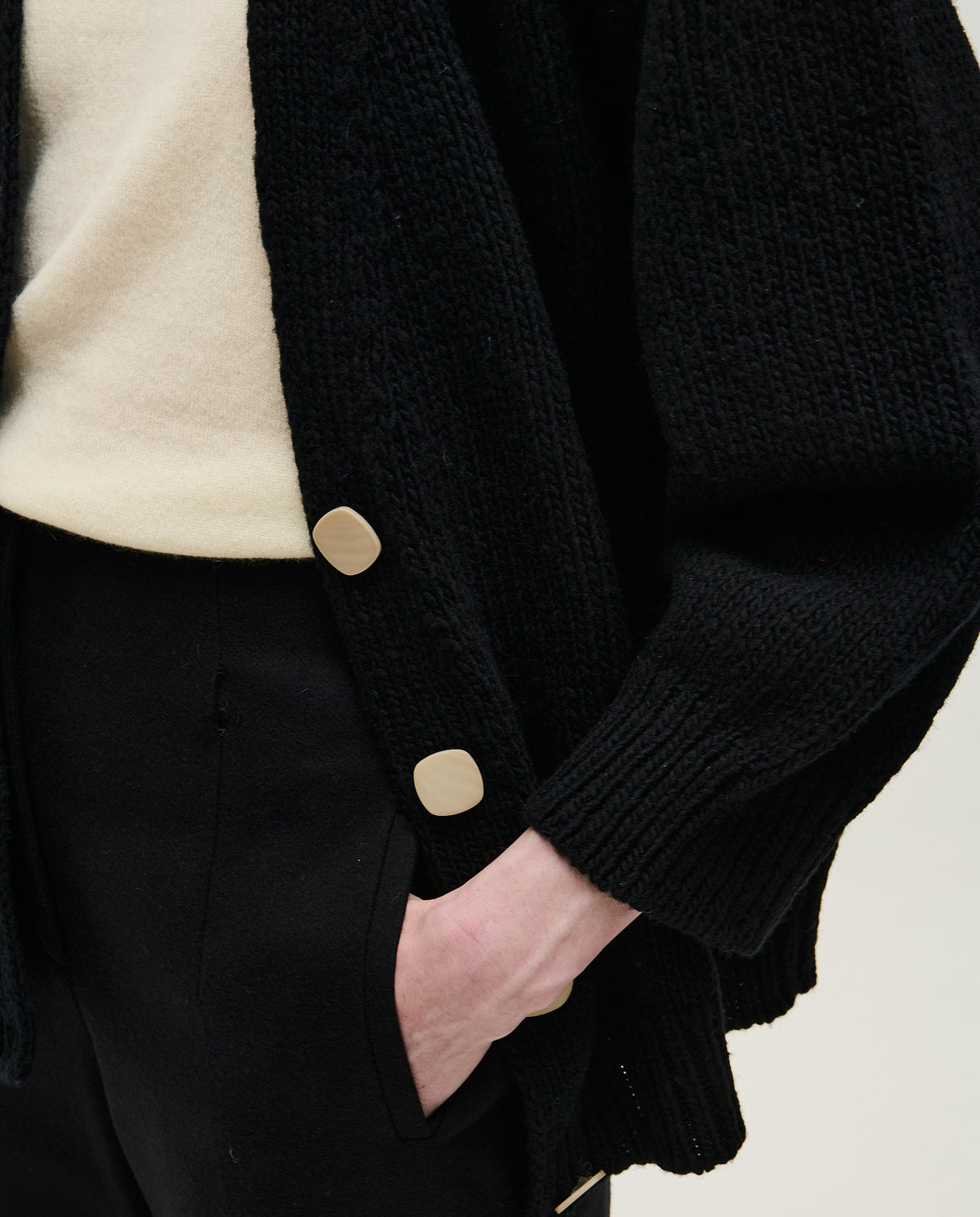 Black women's Babaà No51 cardigan featuring a cozy knit design, displayed on a hanger.
