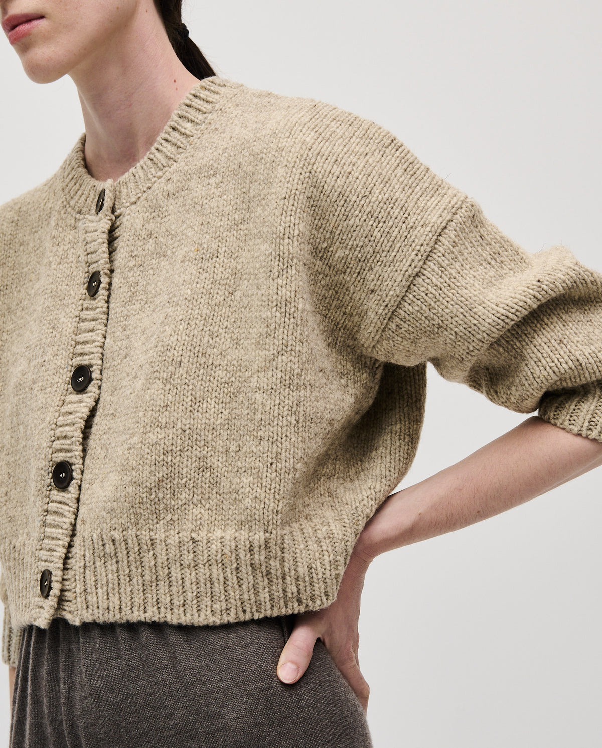Babaà No61 Mist women's cardigan in soft, neutral fabric, featuring a relaxed fit and button closure for casual comfort.