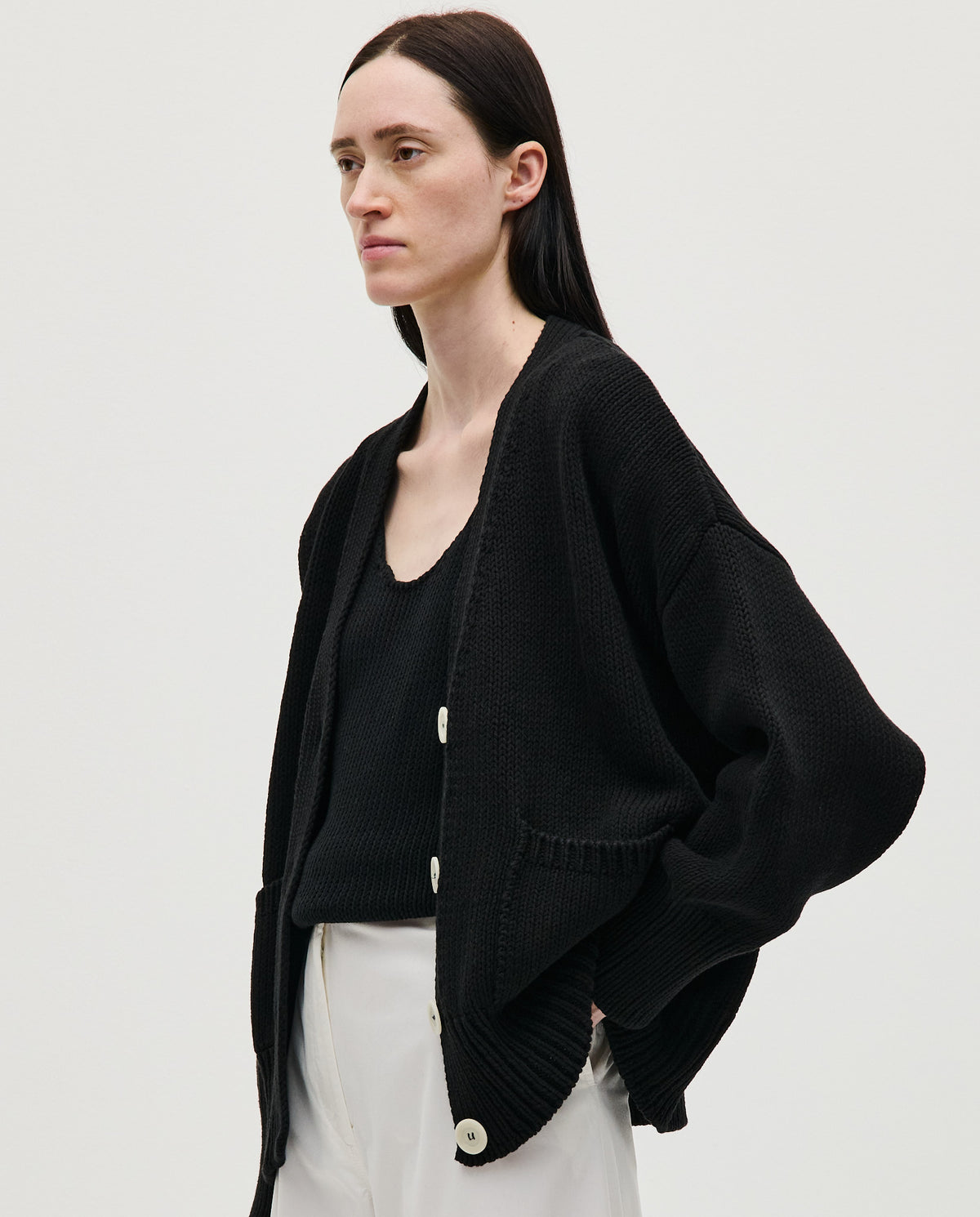 Black Babaà No86 women's cardigan with a relaxed fit, featuring a soft knit texture and button closure.