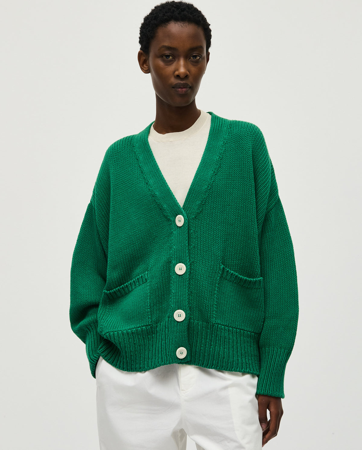 Babaà No86 Tree Fern cardigan worn by a woman, featuring a cozy knit design with a tree fern pattern in earthy tones.