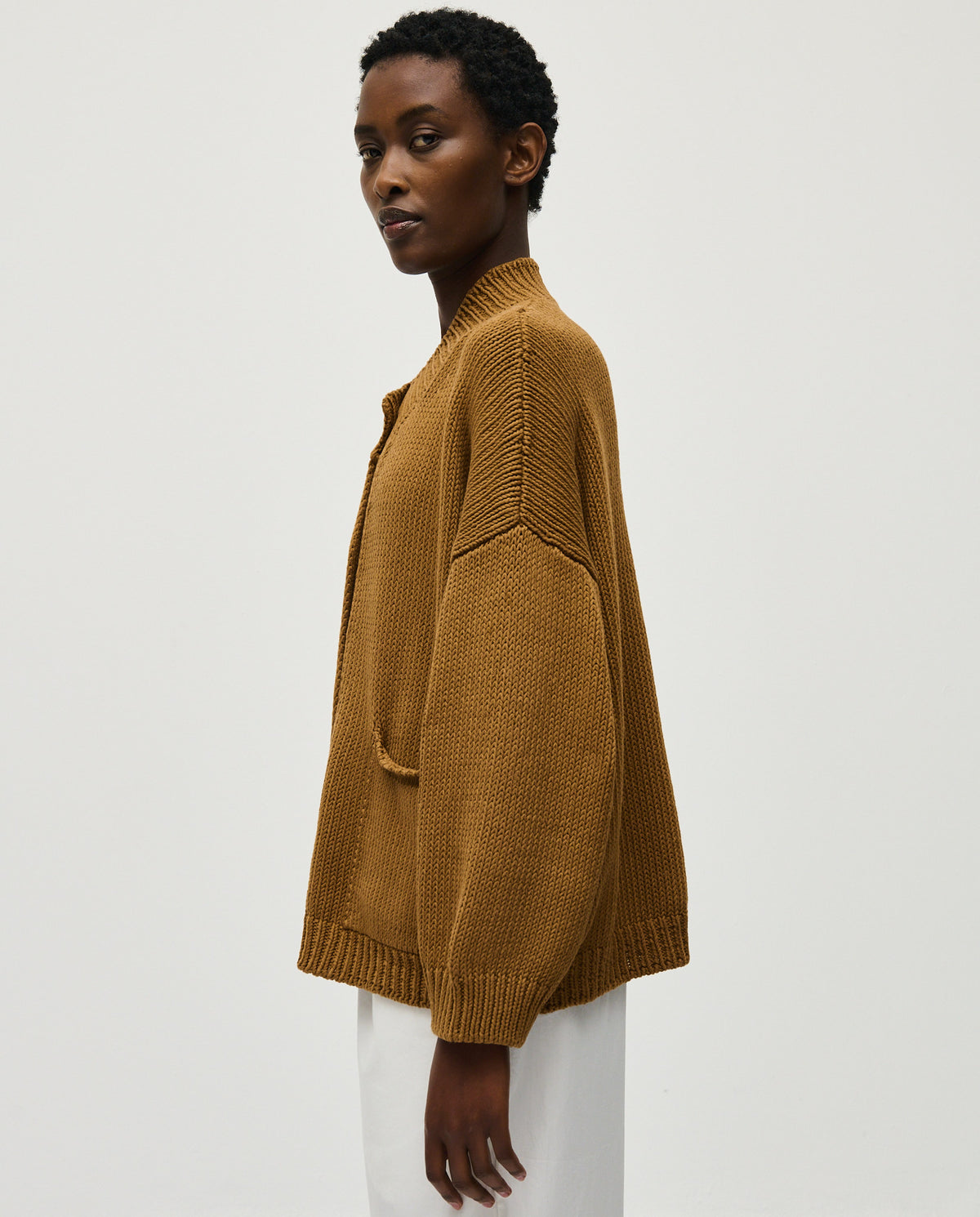 Light brown Babaà No88 Sukkari women's cardigan with a cozy knit texture and button-up front, displayed on a mannequin.