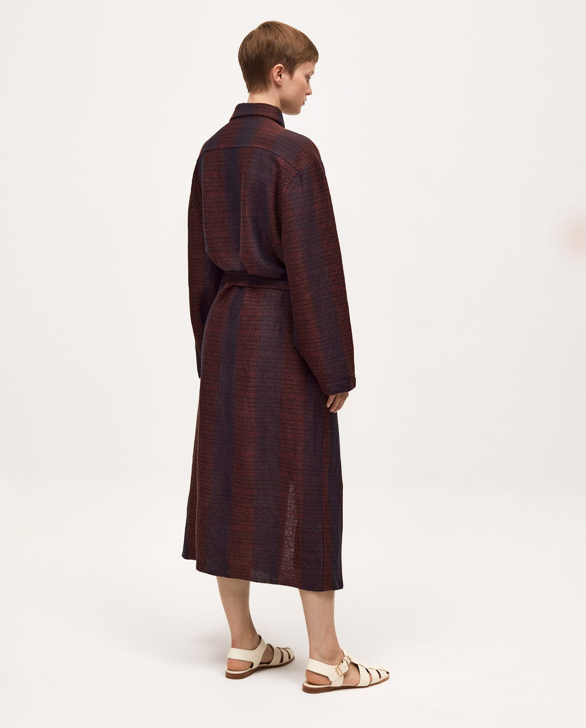 Elegant woman wearing Babaà Dress No58 Midsummer Night, flowing fabric and intricate details for a stylish summer look.