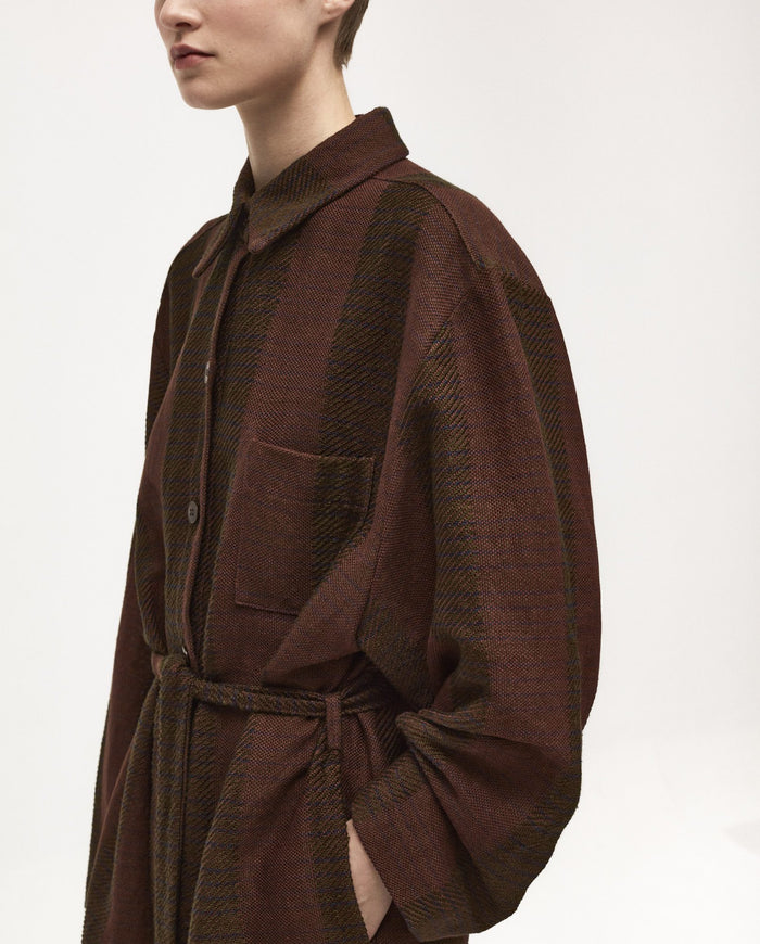 Babaà Dress No58 Tundra, a stylish women's dress with a relaxed fit and earthy Tundra color, displayed on a hanger.
