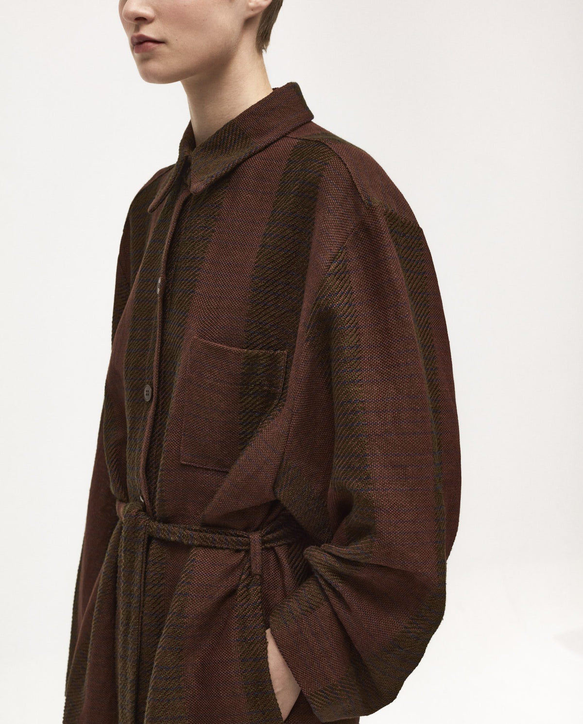 Babaà Dress No58 Tundra, a stylish women's dress with a relaxed fit and earthy Tundra color, displayed on a hanger.