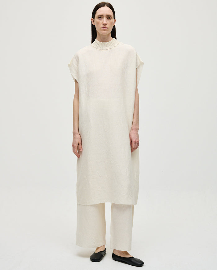 White Babaà Dress No60 for women, featuring a stylish design and elegant fit, shown on a model in a fashion photoshoot.
