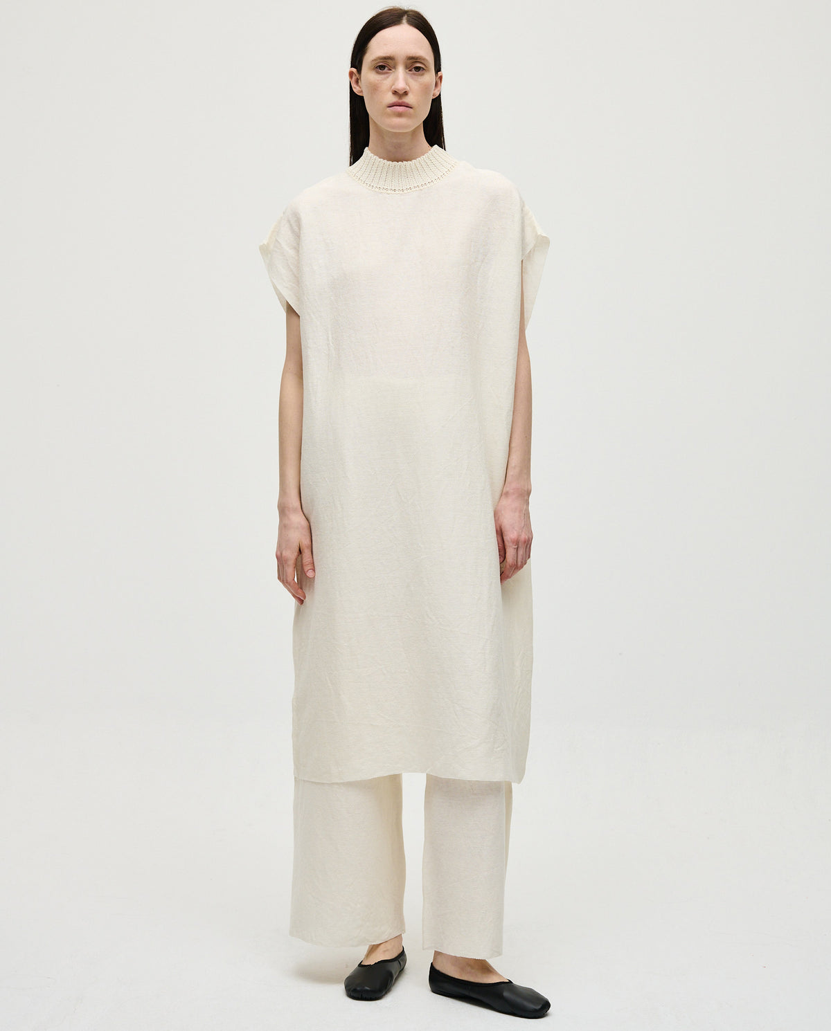 White Babaà Dress No60 for women, featuring a stylish design and elegant fit, shown on a model in a fashion photoshoot.