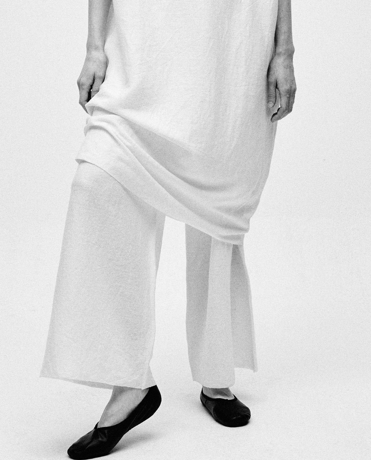 Babaà Dress No60 in white, elegant women's dress with a flowing design and subtle detailing, suitable for casual or formal wear