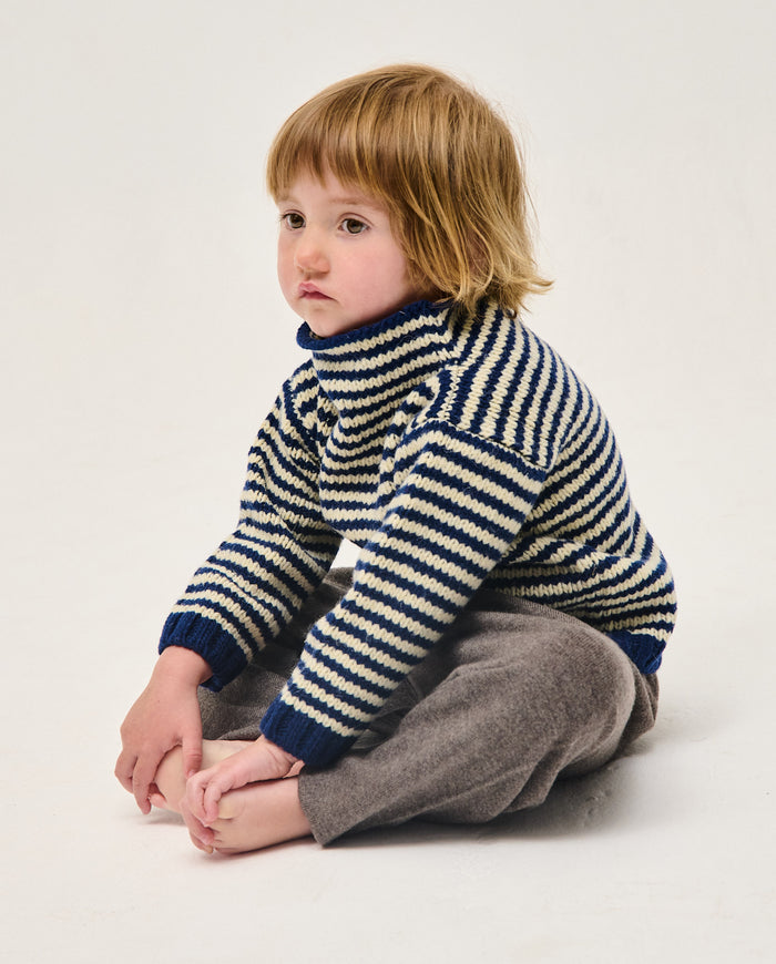 Navy children's jumper by Babaà, showcasing a cozy knit sweater with ribbed cuffs and a classic design for kids.