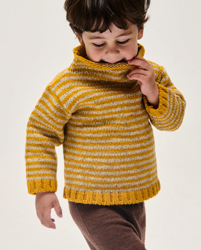 Kids' ochre jumper by Babaà, soft knitted sweater with ribbed cuffs, displayed on a child mannequin.