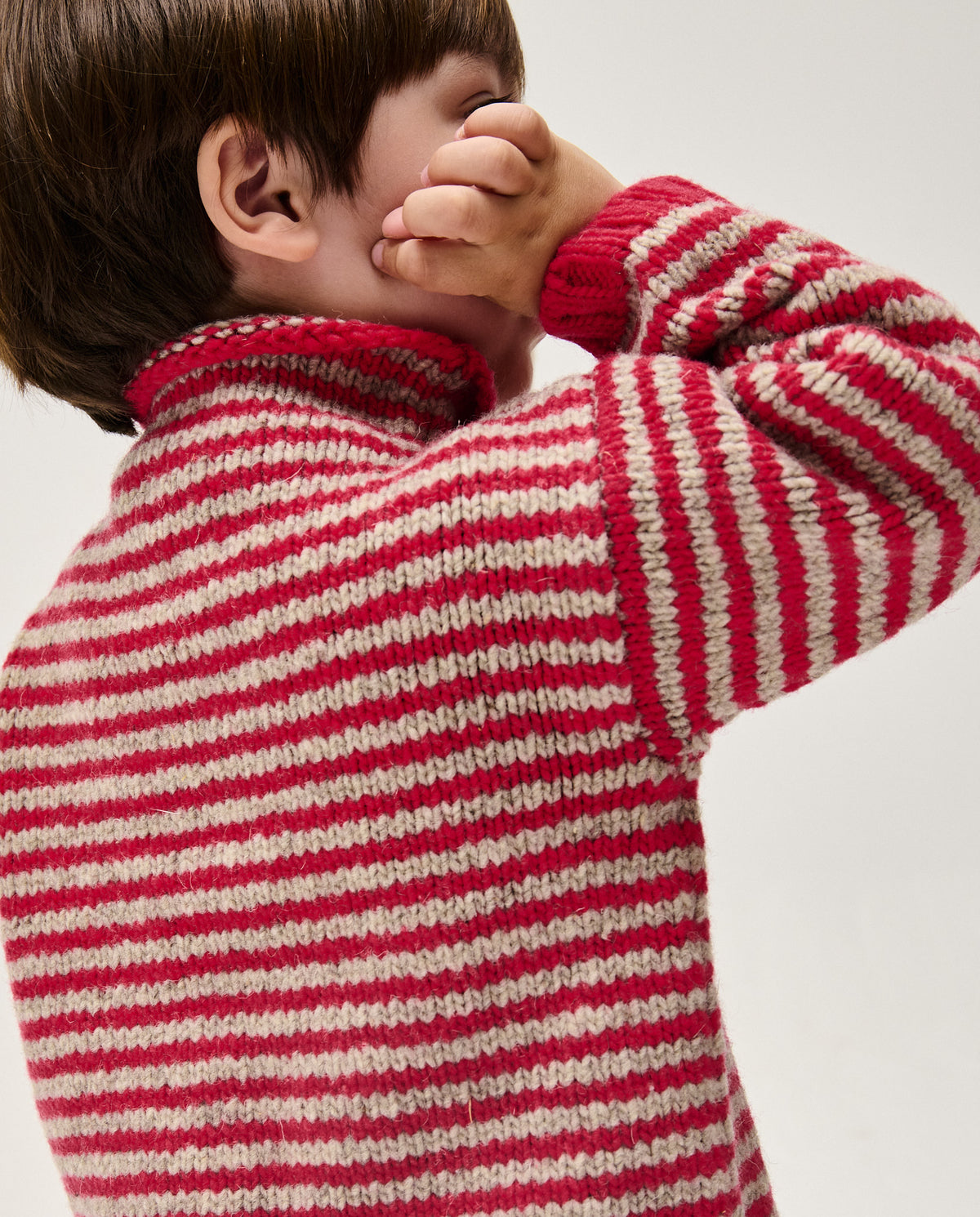 Bright red kids' jumper by Babaà, style No6 Ruby, featuring a cozy knit fabric and a comfortable fit for children.