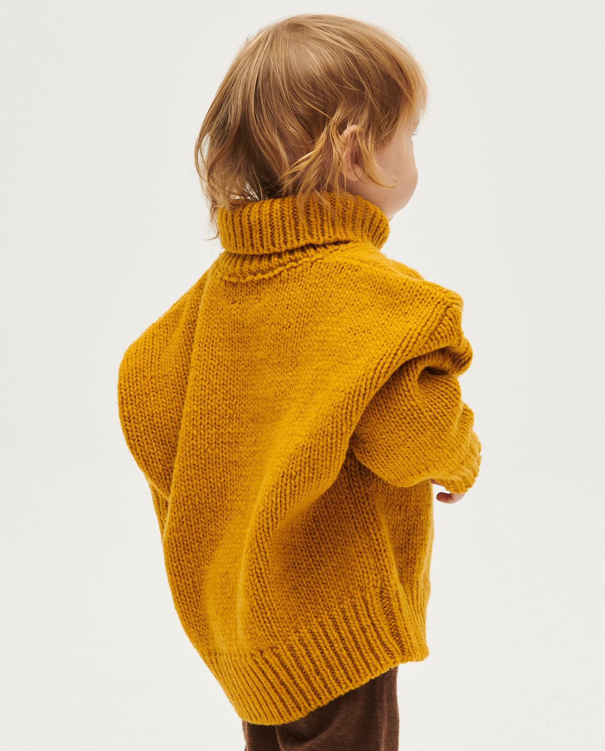 Kids' Babaà No17 ochre jumper featuring a cozy, knitted design and ribbed cuffs, perfect for casual wear.