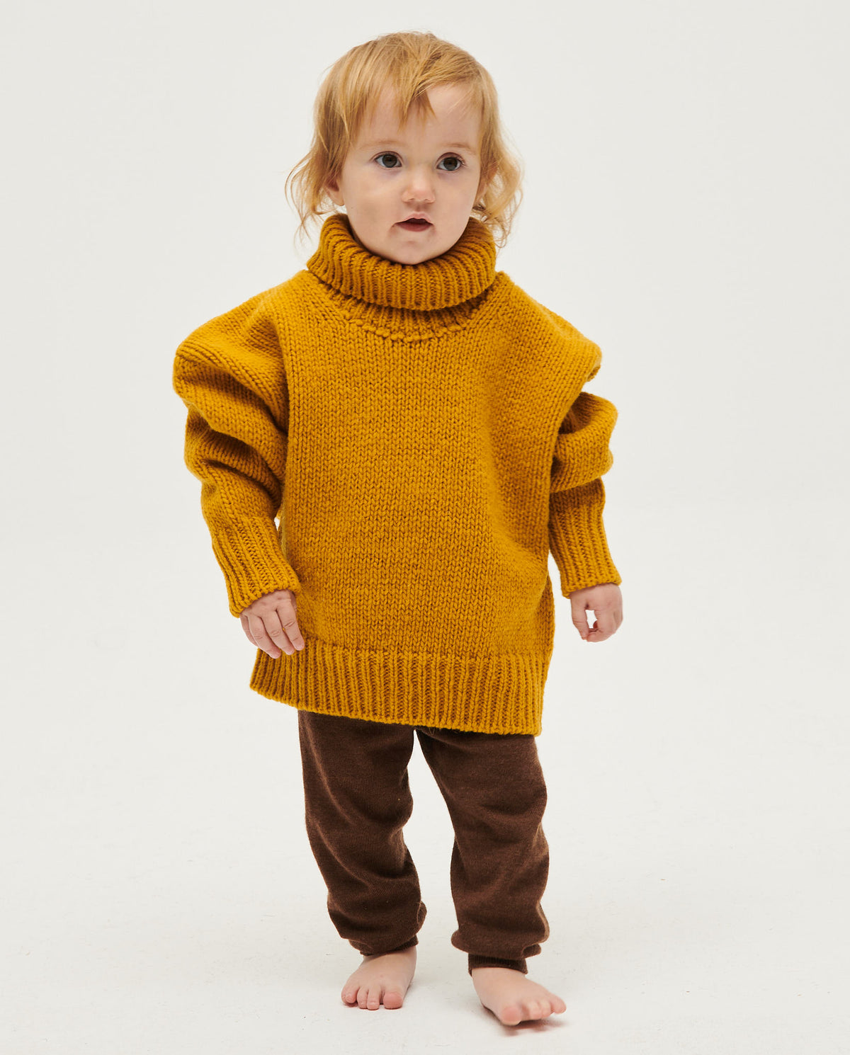 Kids' ochre jumper by Babaà, featuring a cozy knitted design and long sleeves, perfect for casual and stylish wear.