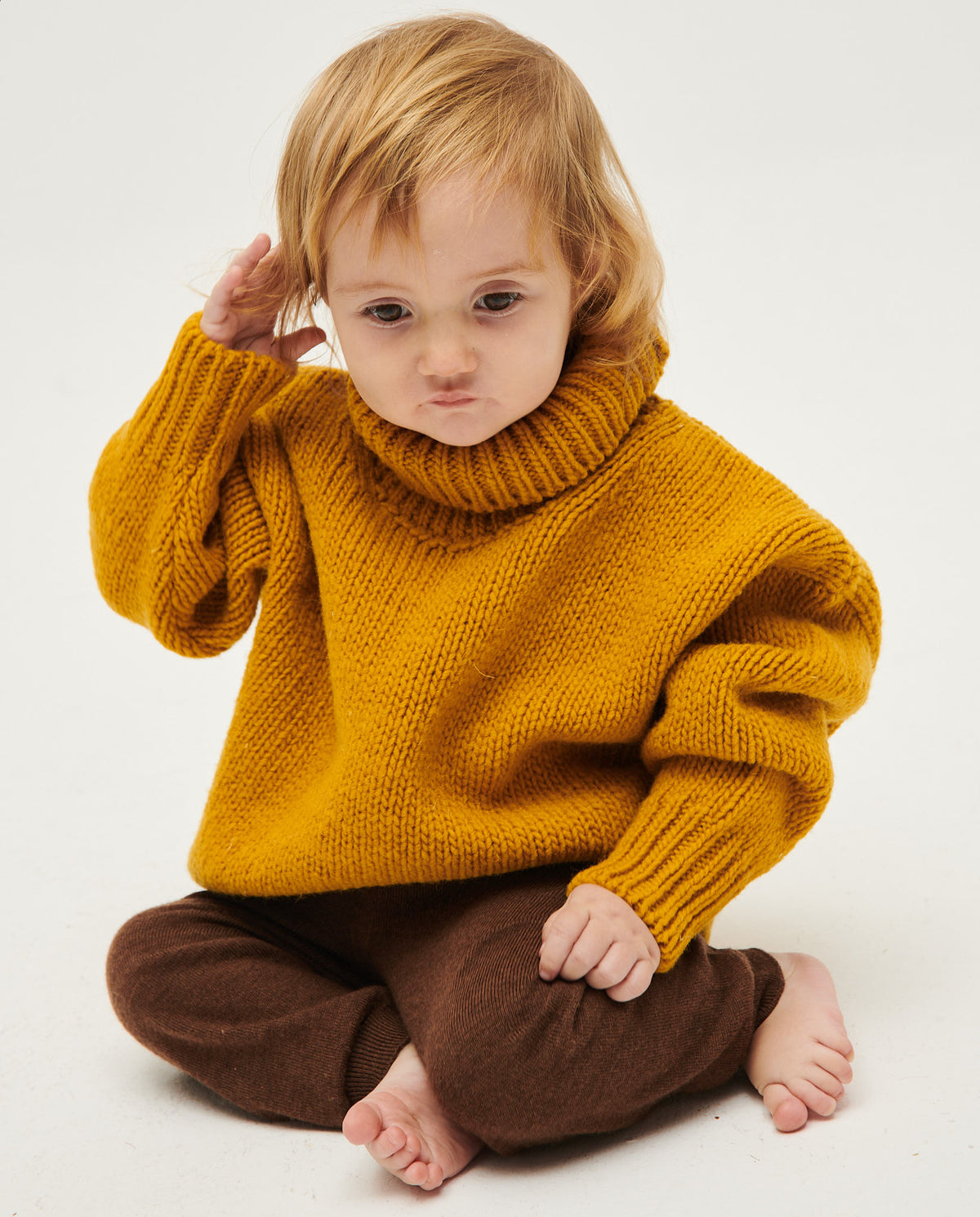 Kids' jumper by Babaà in ochre color, featuring a cozy knit fabric and classic design, perfect for casual wear.