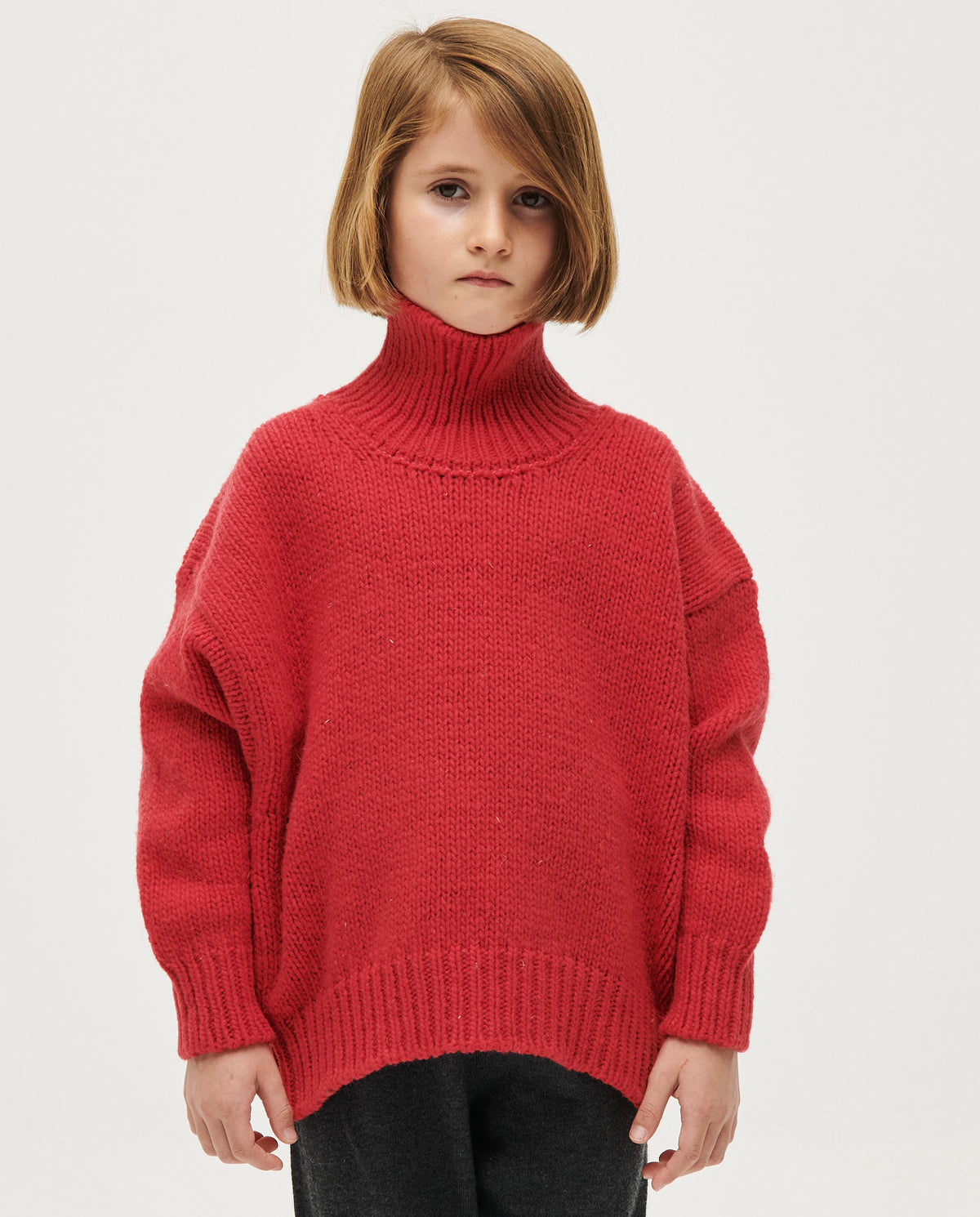 Kids' ruby-colored jumper by Babaà, featuring a cozy knit design, perfect for children's casual and everyday wear.