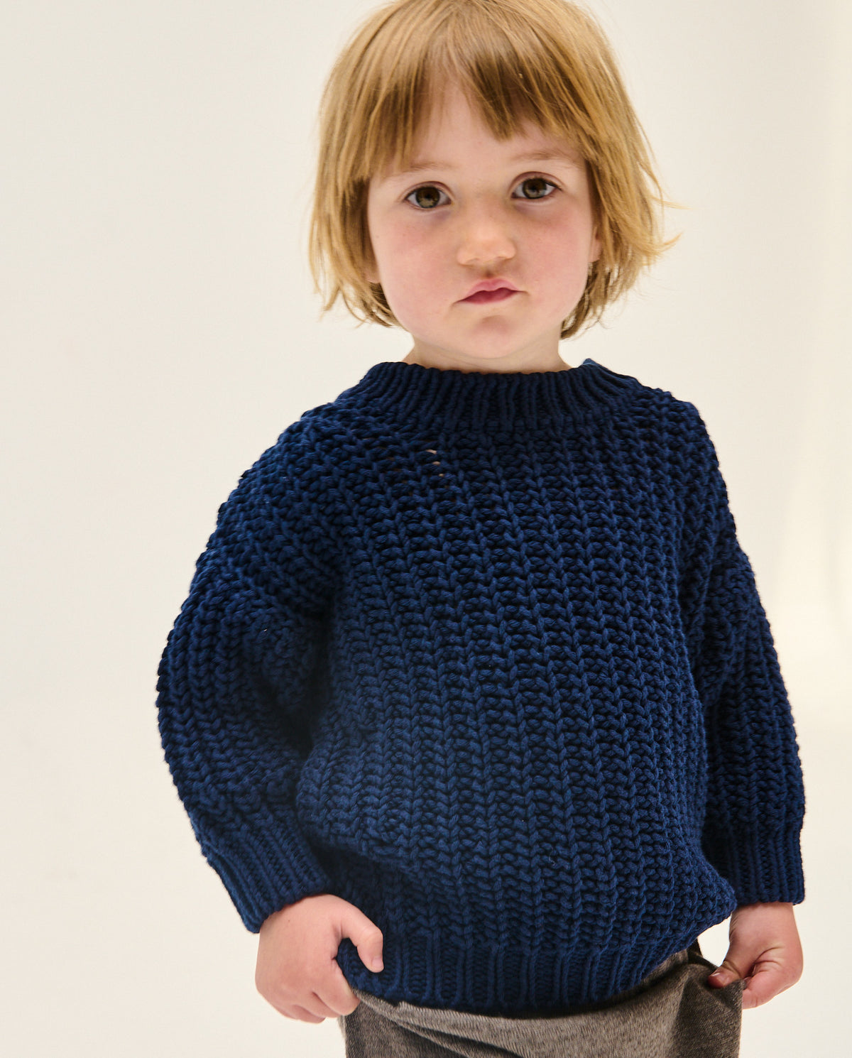 Navy kids' jumper No18 by Babaà, featuring a cozy knitted design and ribbed cuffs, perfect for children.