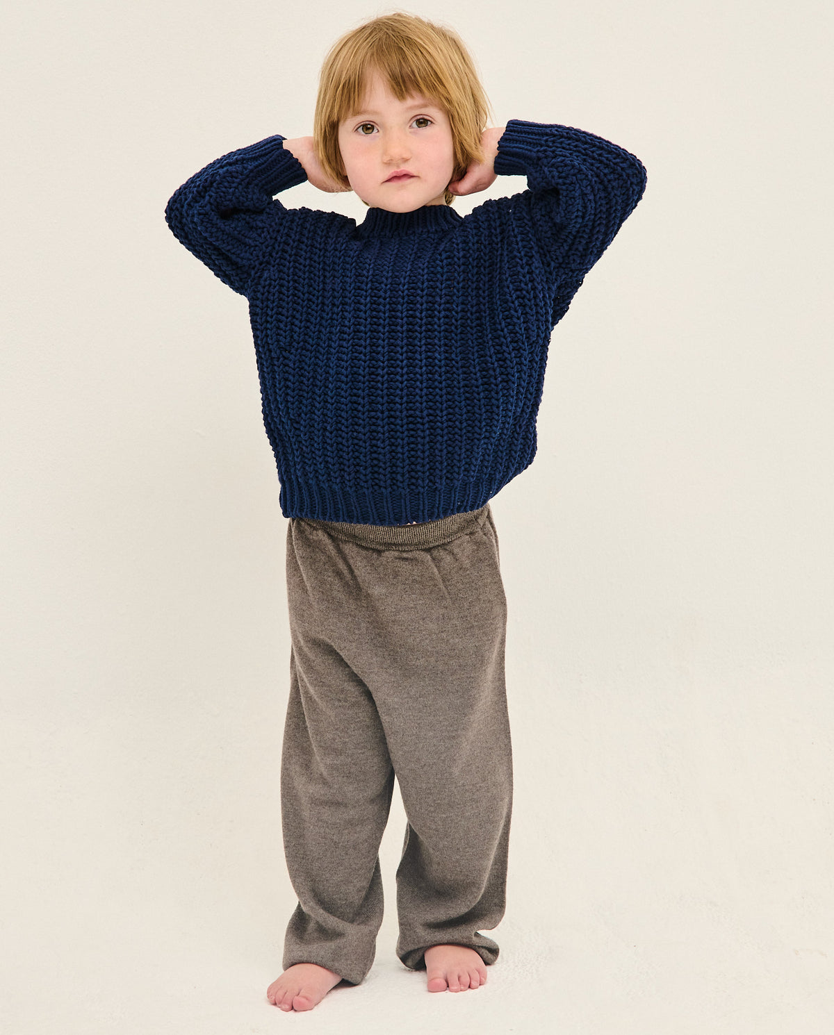 Kids navy jumper by Babaà, featuring a soft knitted fabric and a cozy, stylish design perfect for children.