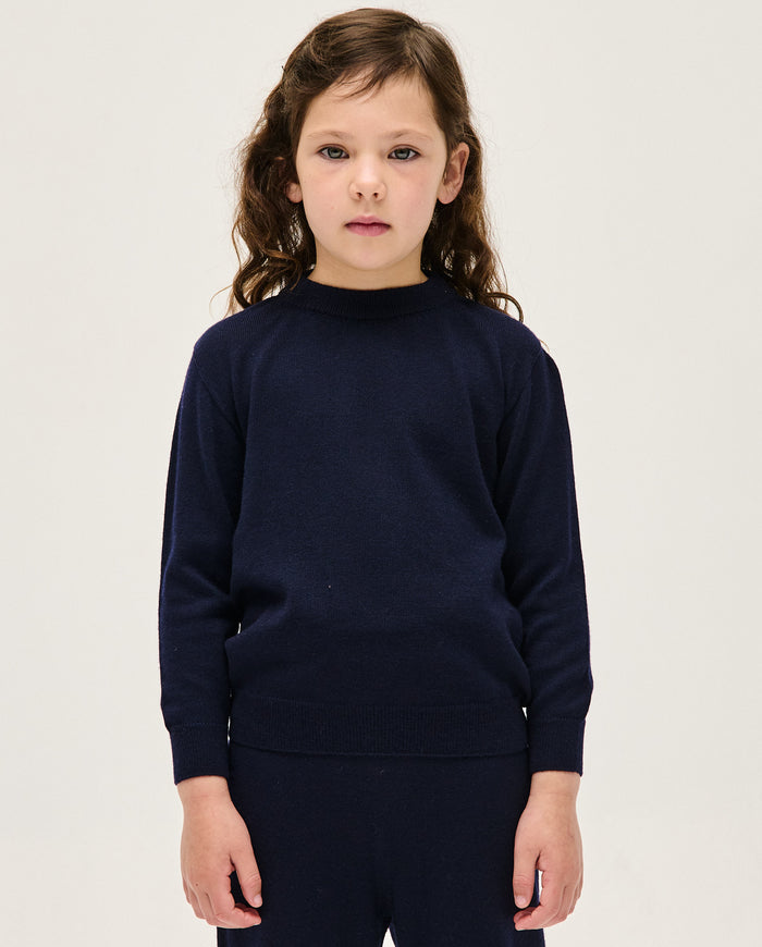 Navy kids' jumper from Babaà with a cozy knit design, featuring a round neckline and long sleeves, perfect for cold weather.