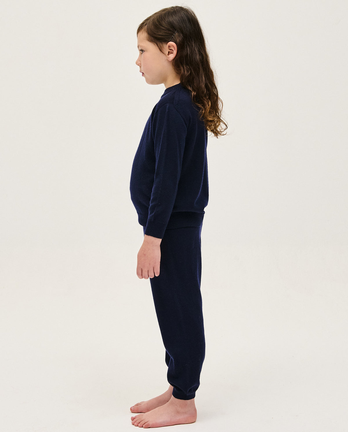 Kids' navy jumper by Babaà, featuring a cozy knit design, shown laid flat with long sleeves and ribbed cuffs.