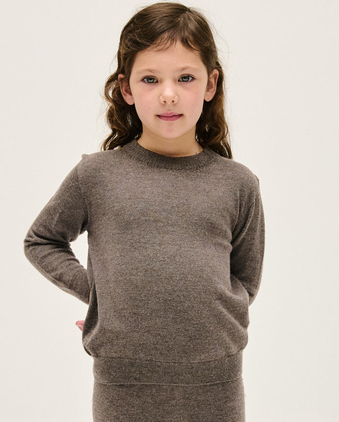 Kids' jumper from Babaà No25 Volcán, featuring a cozy, colorful design with a high neckline and playful pattern.