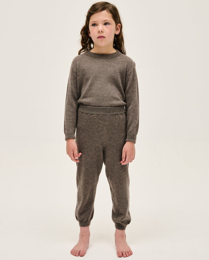 Kids' jumper by Babaà, No25 Volcán in vibrant volcanic orange, featuring cozy knit fabric and stylish design.
