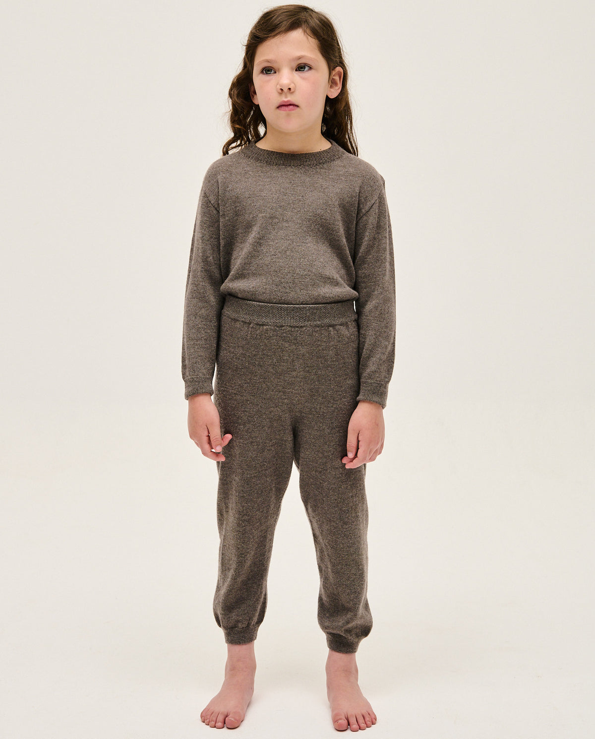 Kids' jumper by Babaà, No25 Volcán in vibrant volcanic orange, featuring cozy knit fabric and stylish design.
