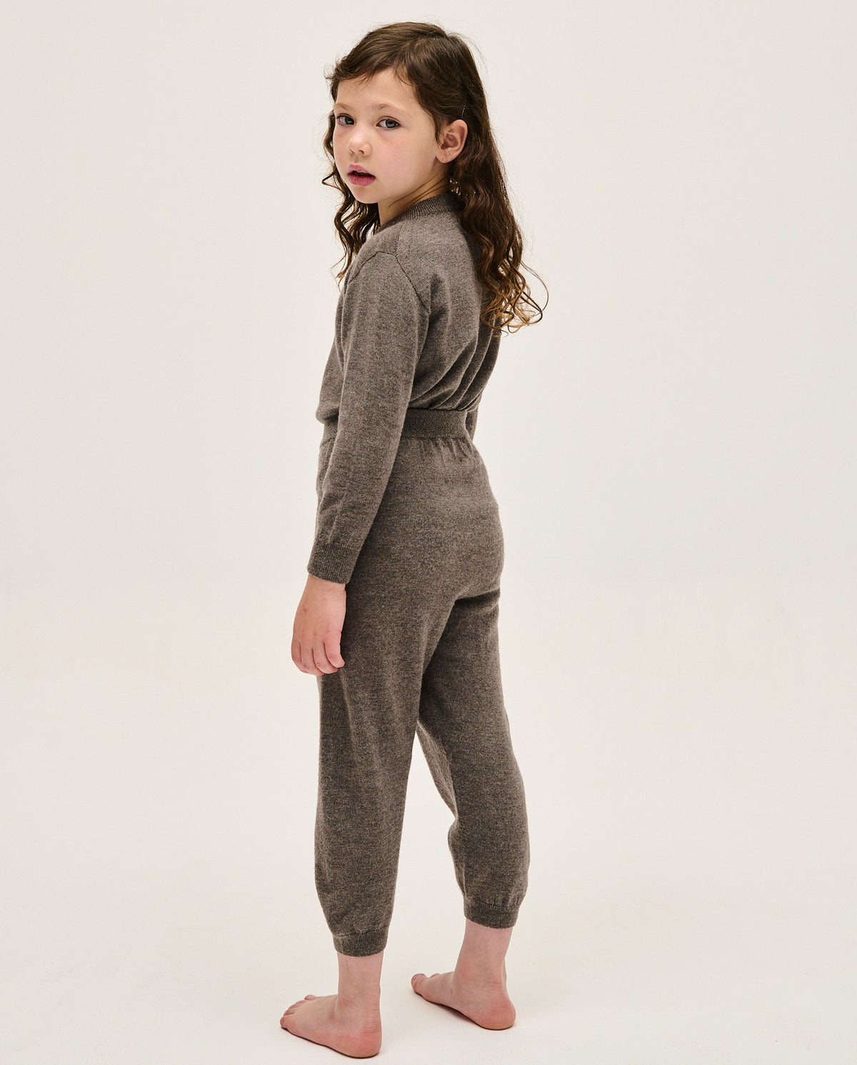 Kids' jumper by Babaà in No25 Volcano color, featuring a cozy knit design and ribbed cuffs, suitable for cold weather.