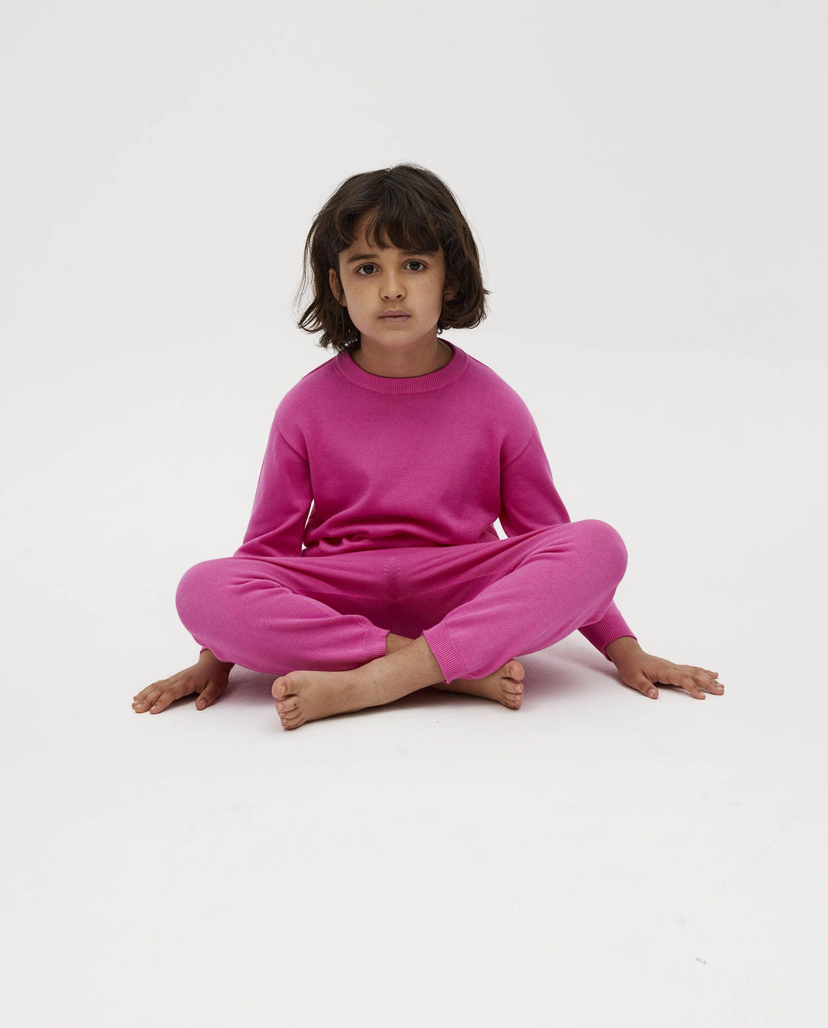 Kids' jumper by Babaà featuring a hibiscus flower design, shown in a colorful, cozy fabric with a round neckline.