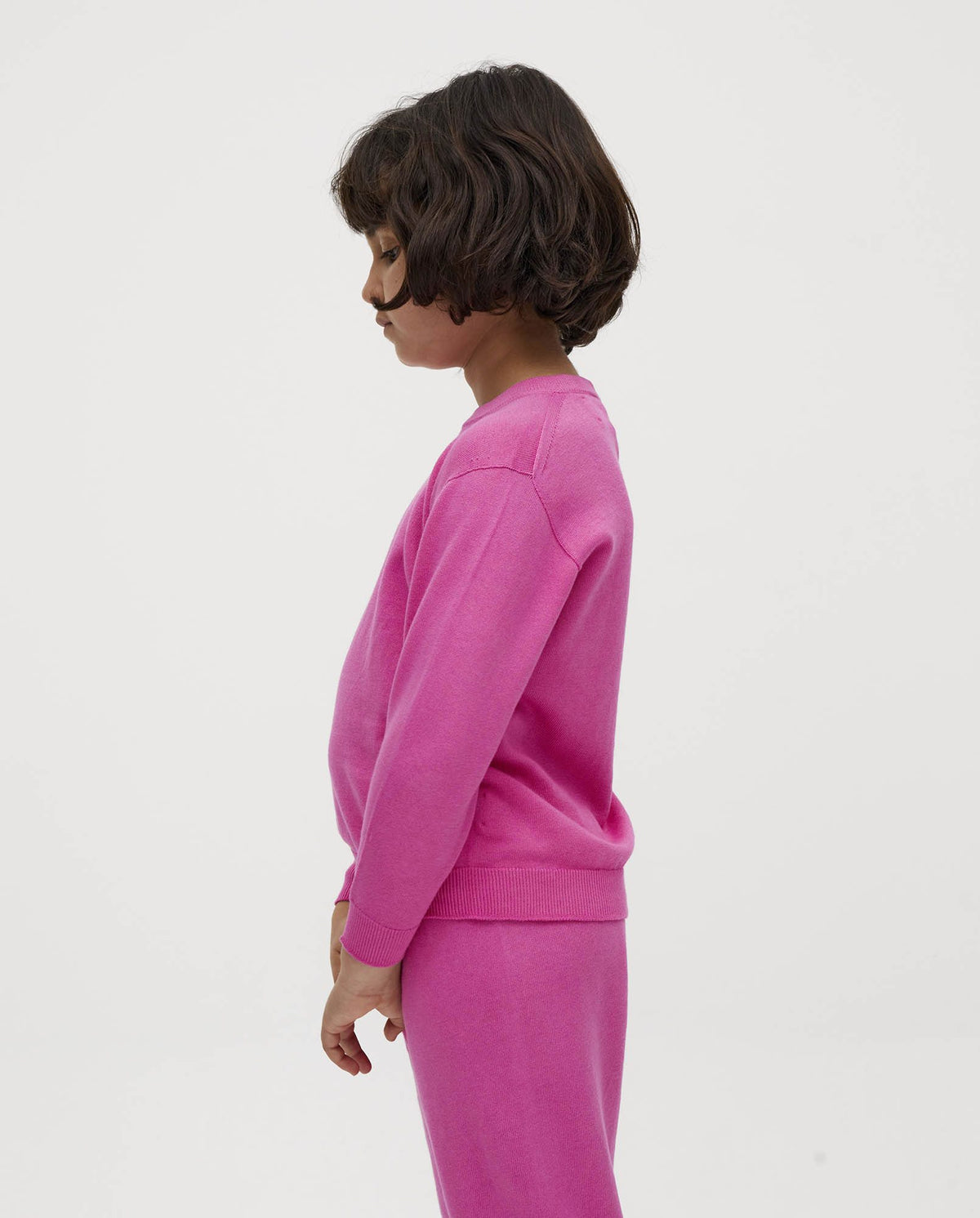 Kids' jumper by Babaà featuring a vibrant hibiscus flower design, shown in a colorful, comfortable fabric with floral pattern.