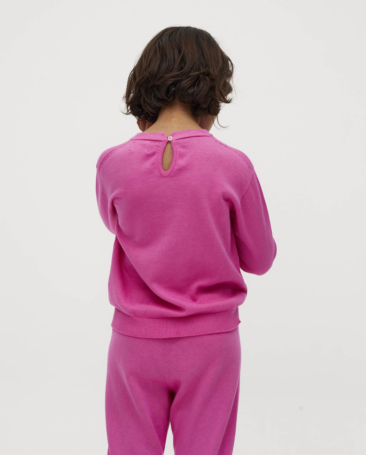 Kids' jumper by Babaà with hibiscus flower print, featuring a soft fabric and colorful floral design suitable for children.