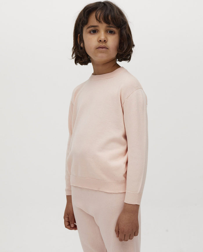Kids' jumper by Babaà in Petal Plum color, featuring a cozy knitted design suitable for children.