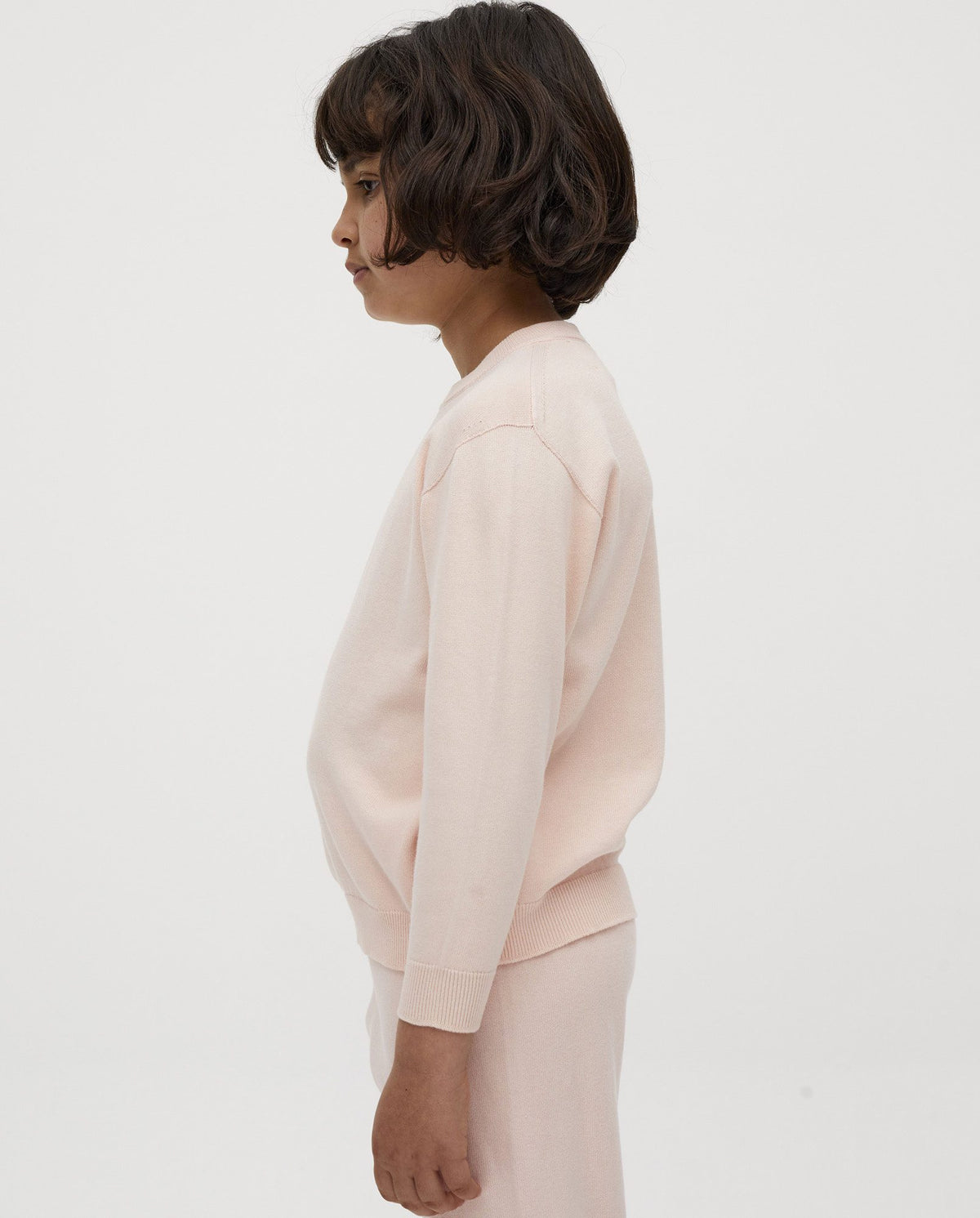 Kids' jumper by Babaà in Petal Plum color, featuring a cozy knit design for children.