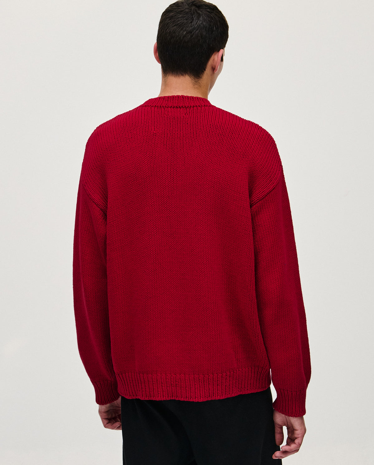 Babaà Jumper Man No16 Persephone in dark green, featuring a cozy knit design and ribbed cuffs, displayed on a mannequin.