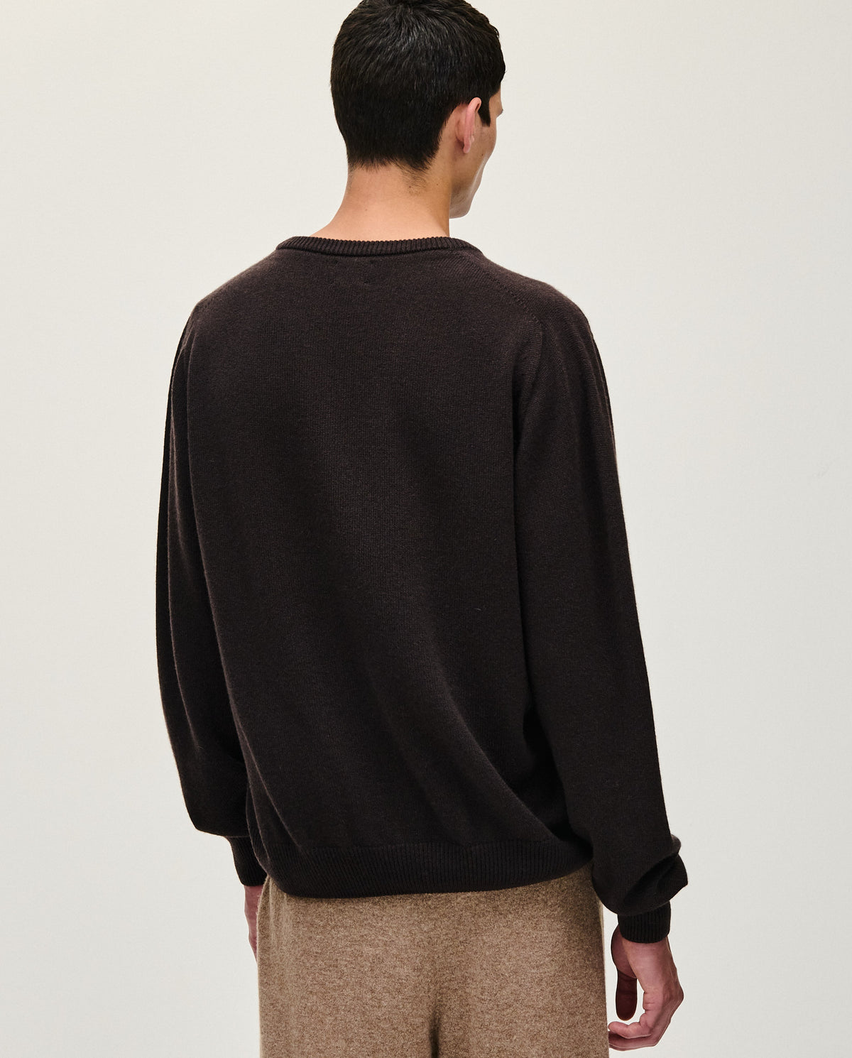 Black Babaà No91 Blackwood men's jumper displayed on a model, showcasing a stylish black knit sweater.