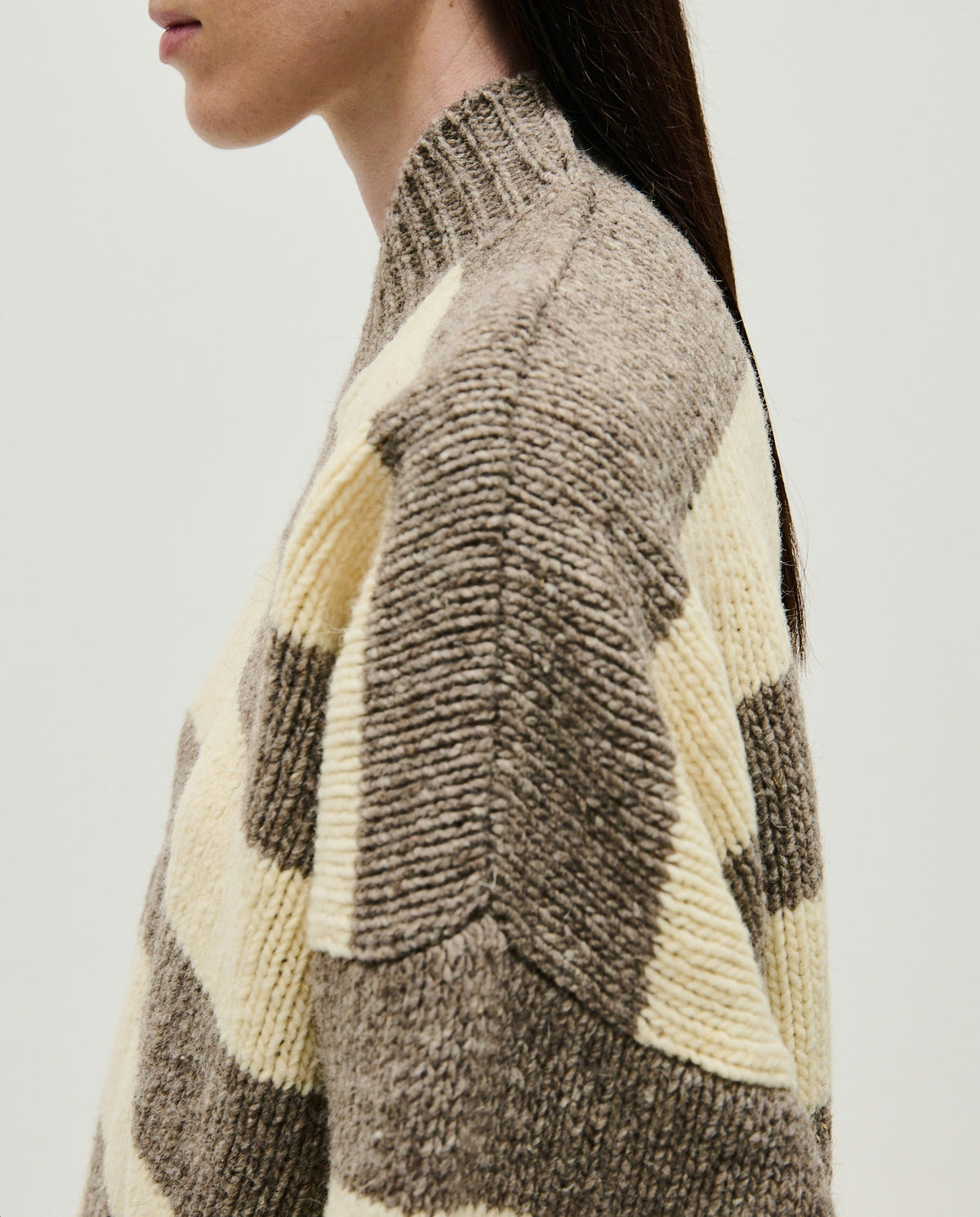 Babaà No40 Savannah jumper, soft knit sweater in neutral tones, displayed on a hanger with a cozy, casual style.