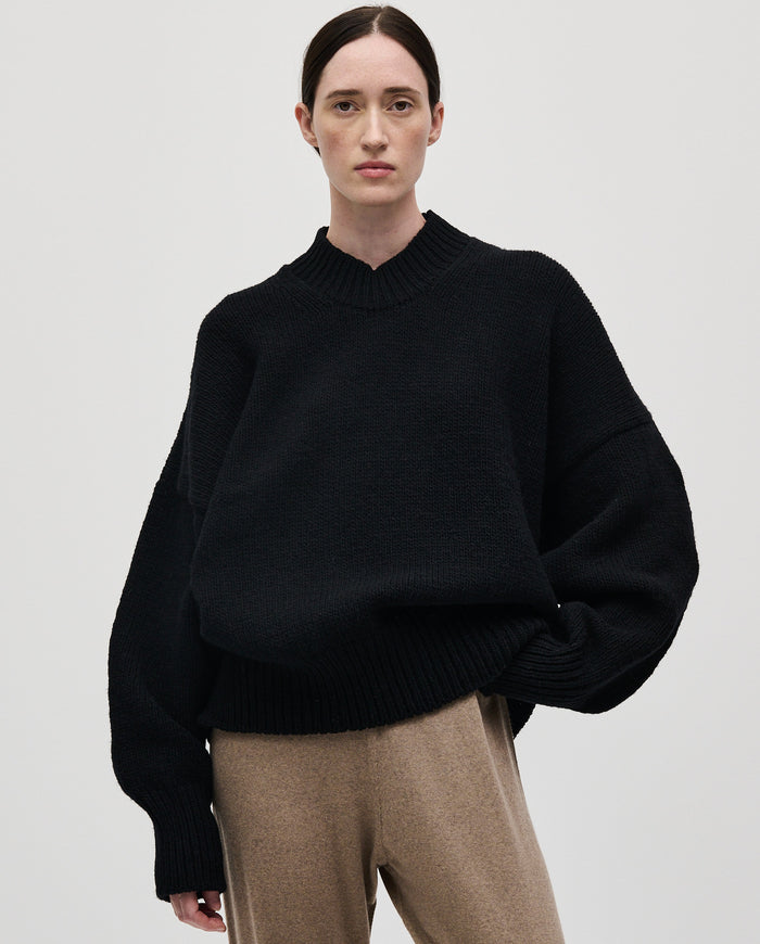 Black Babaà No11 women's jumper displayed on a model, showcasing its stylish fit and soft fabric for casual wear.
