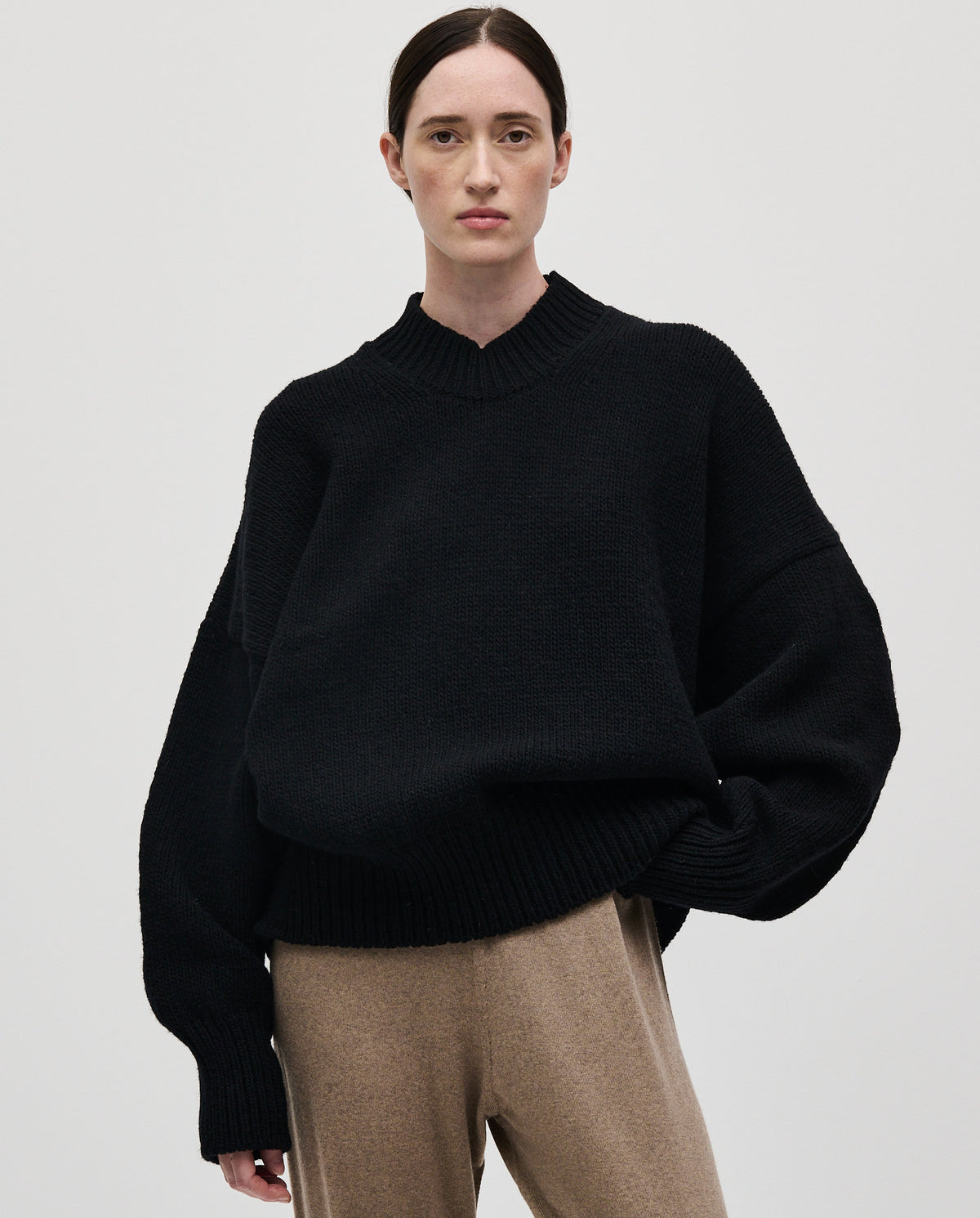 Black Babaà No11 women's jumper displayed on a model, showcasing its stylish fit and soft fabric for casual wear.