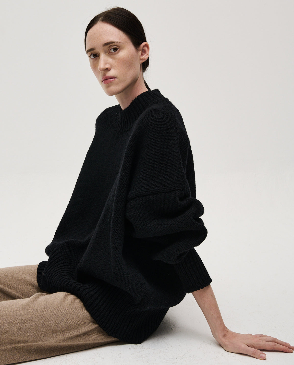 Black Babaà No11 women's jumper, cozy knit sweater with a relaxed fit, shown on a model.