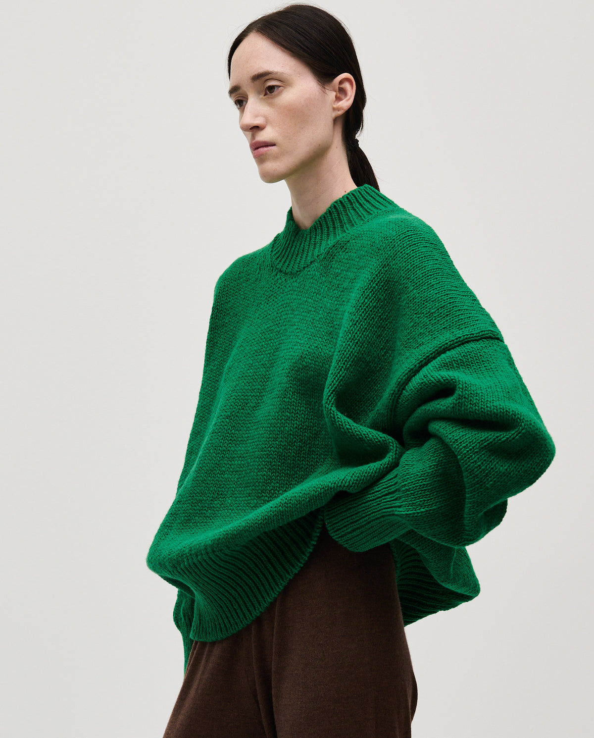 Babaà No11 emerald women's jumper displayed on a model, featuring a cozy knit design in vibrant emerald green.