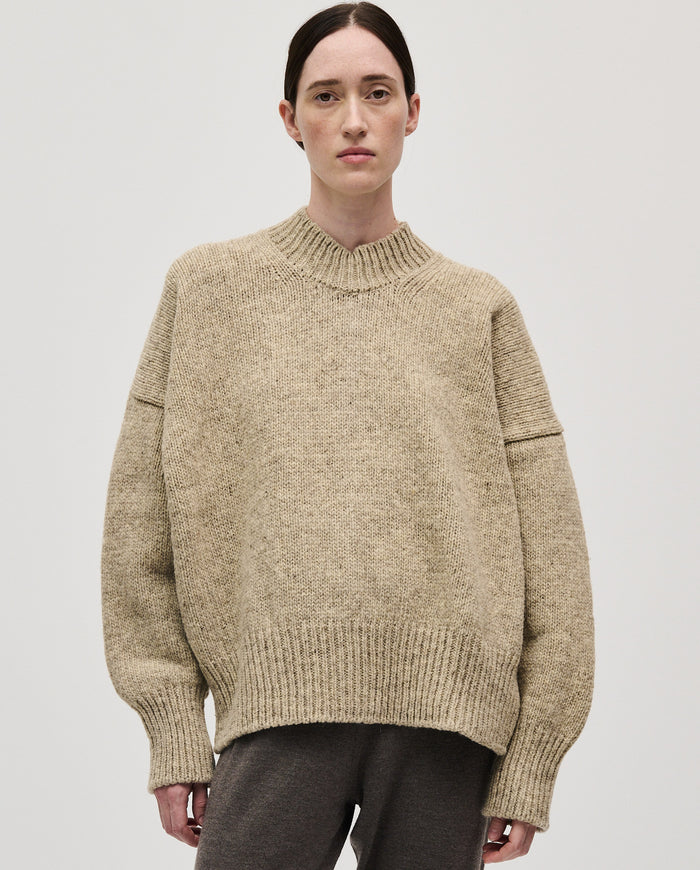 Woman wearing Babaà No11 Mist jumper, showcasing the cozy, soft knit with a relaxed fit and stylish design.