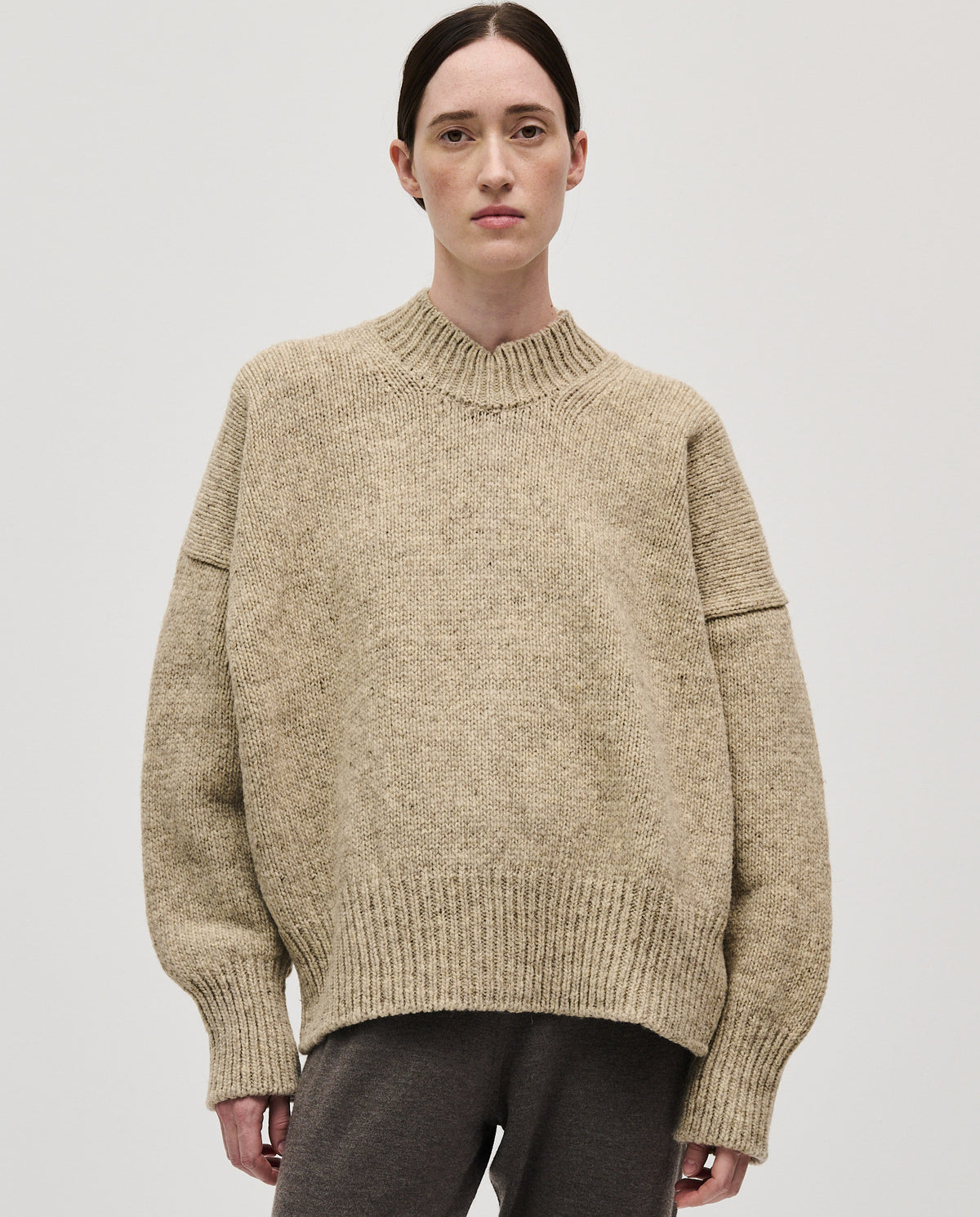 Woman wearing Babaà No11 Mist jumper, showcasing the cozy, soft knit with a relaxed fit and stylish design.