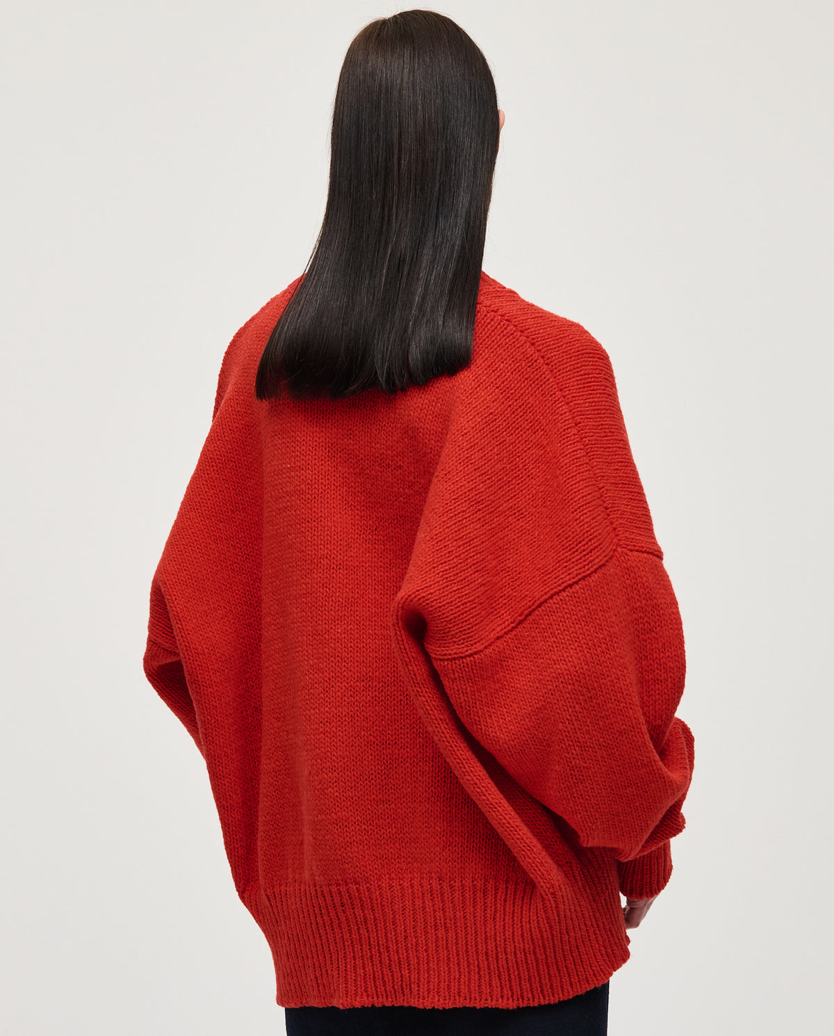Red Babaà No11 women's jumper displayed on a model, showcasing a cozy, stylish knit sweater with a relaxed fit.