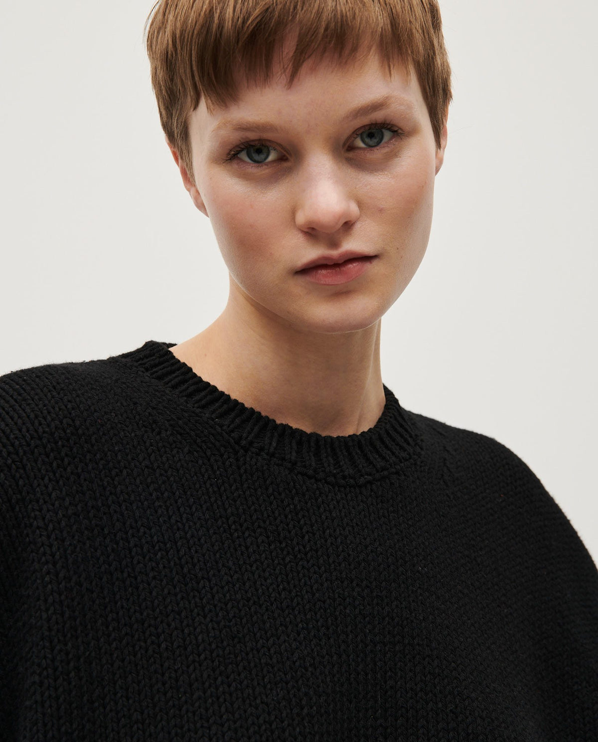 Black Babaà Jumper No14 worn by a woman, showing the cozy knit fabric and relaxed fit style.