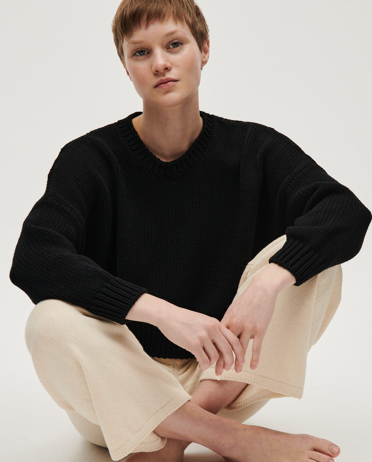 Black Babaà No14 women's jumper with a cozy, fitted design, shown on a woman, highlighting soft fabric and stylish fit.
