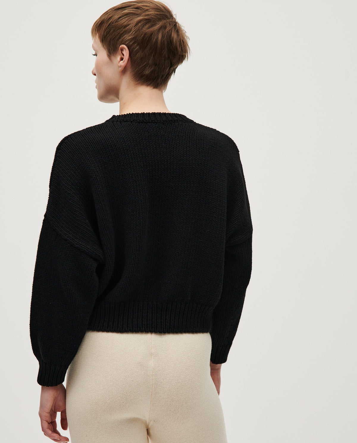 Black Babaà Jumper No14 women's knit sweater, featuring a cozy fit and stylish design, shown on a model.