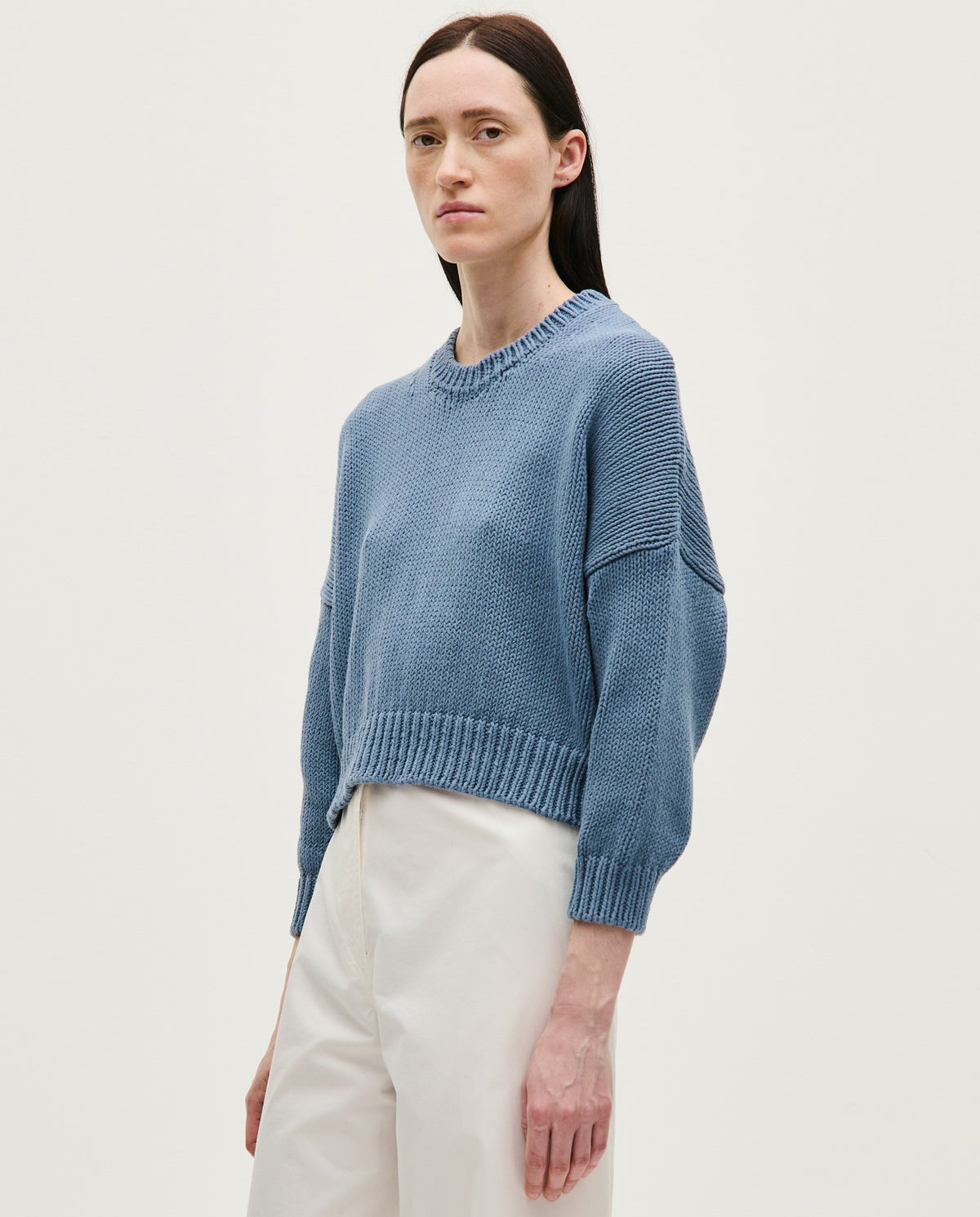 Babaà Jumper No14 Midnight Ocean, a woman wearing a stylish knit jumper in deep midnight blue, showcasing soft fabric and cozy fit.