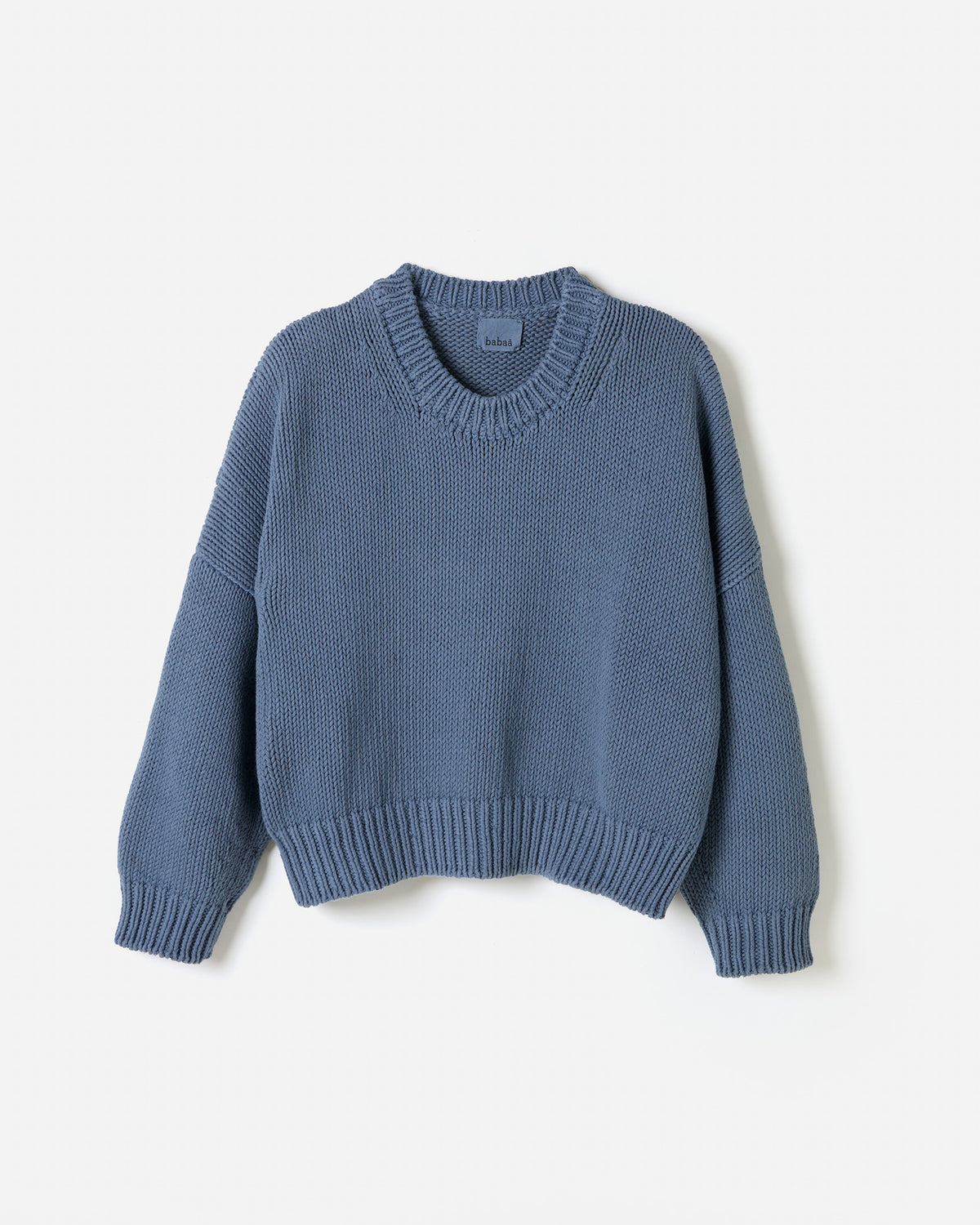 Woman wearing Babaà No14 Midnight Ocean jumper, showcasing a stylish silhouette in a cozy, elegant knit.