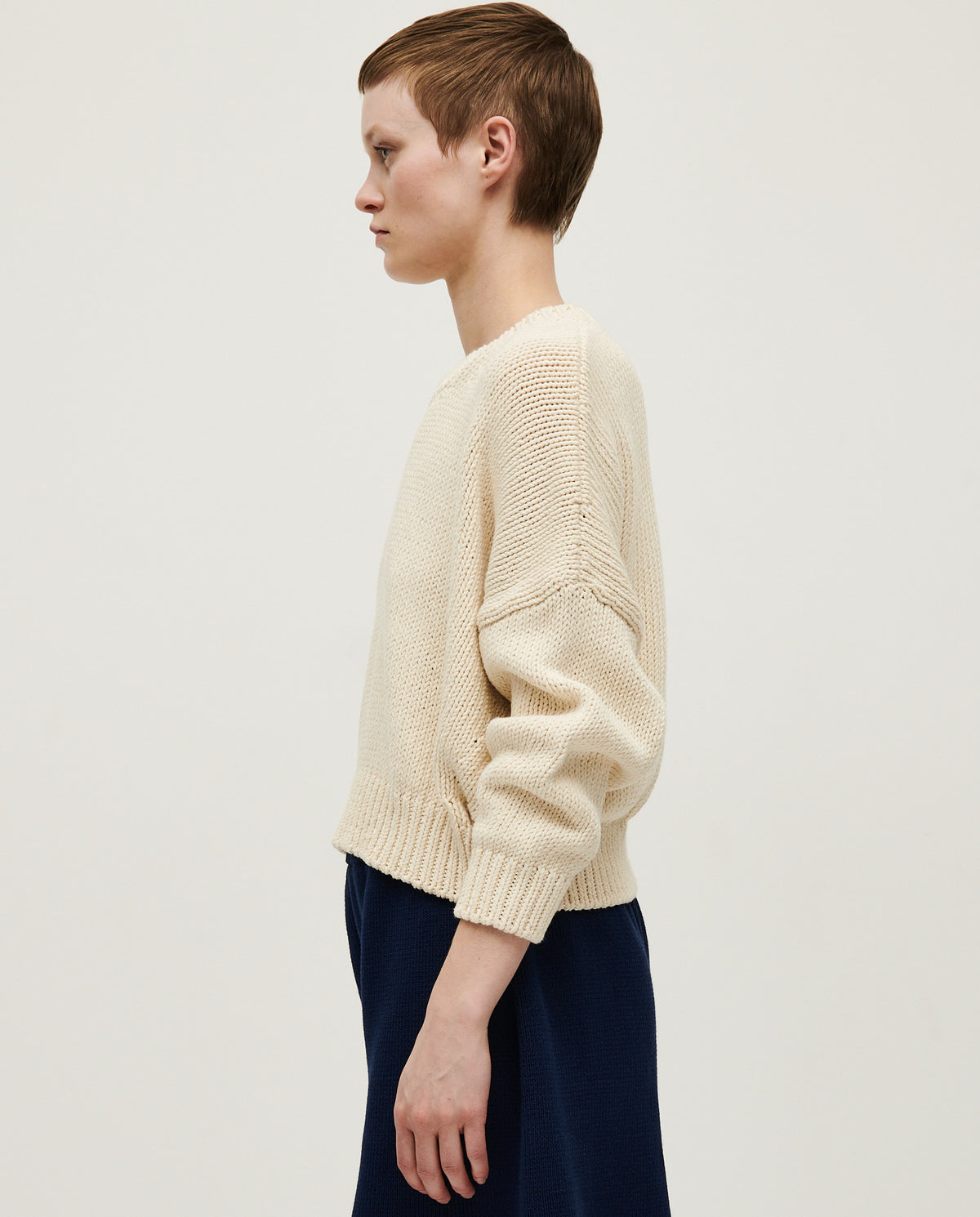 Woman wearing Babaà No14 Natural jumper, soft knit sweater with a relaxed fit and natural beige color.