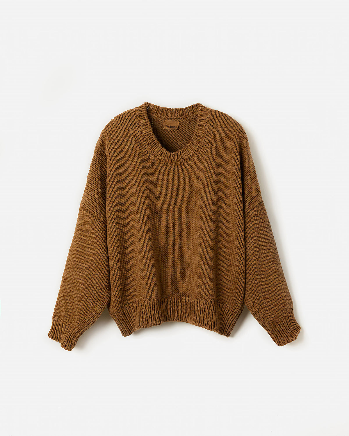Silhouette of a woman wearing Babaà Jumper No14 Sukkari, a stylish and cozy knit sweater for women.