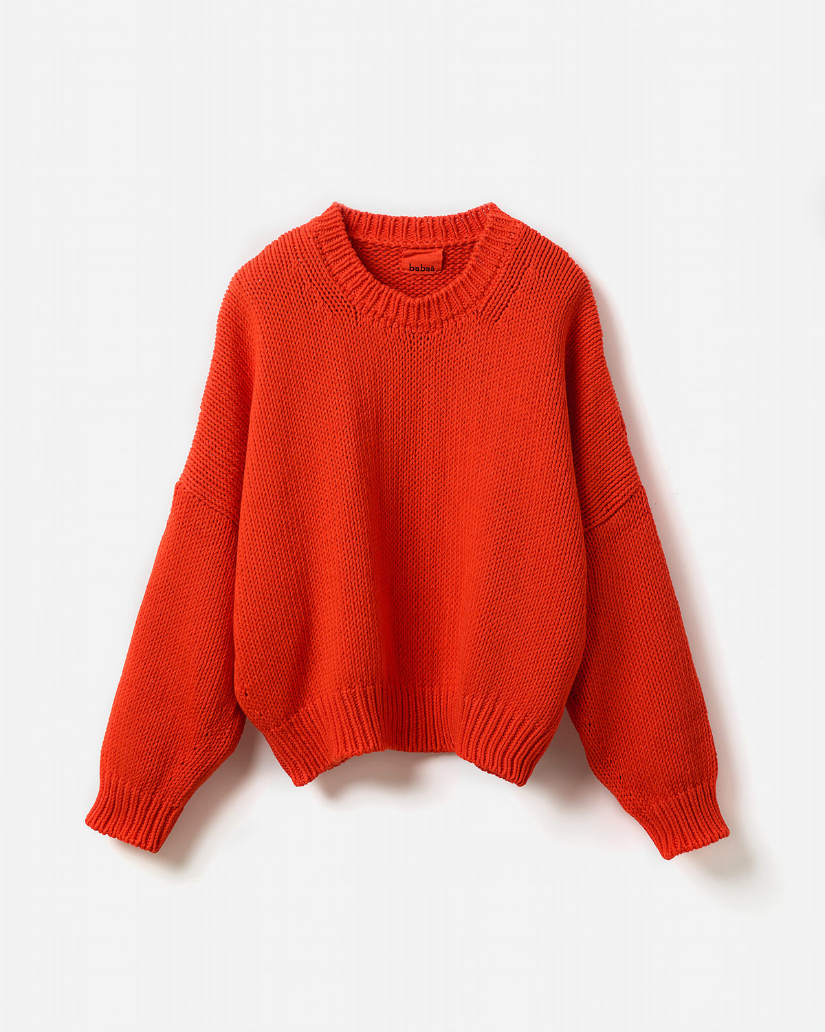 Babaà No14 Summer Flame jumper worn by a woman, featuring a lightweight design and vibrant flame pattern in silhouette style.