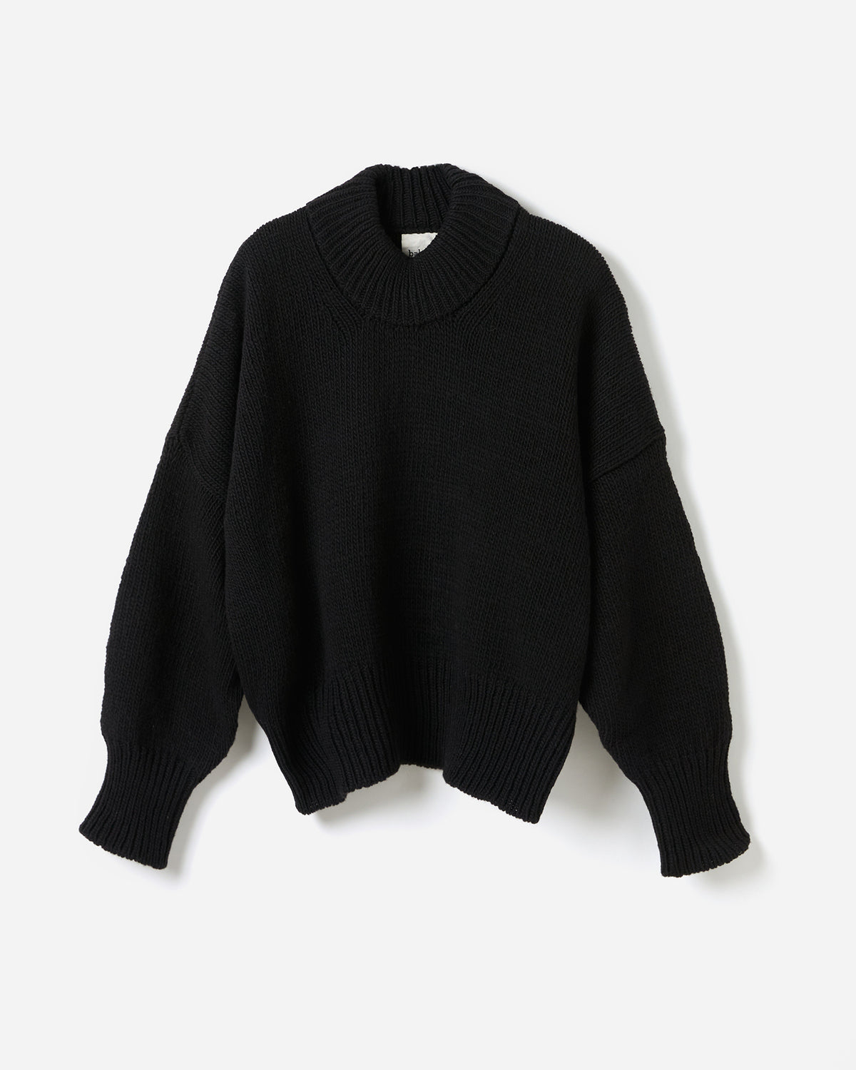 Black Babaà Jumper No15 worn by a woman, showcasing a stylish silhouette in a casual fashion setting.